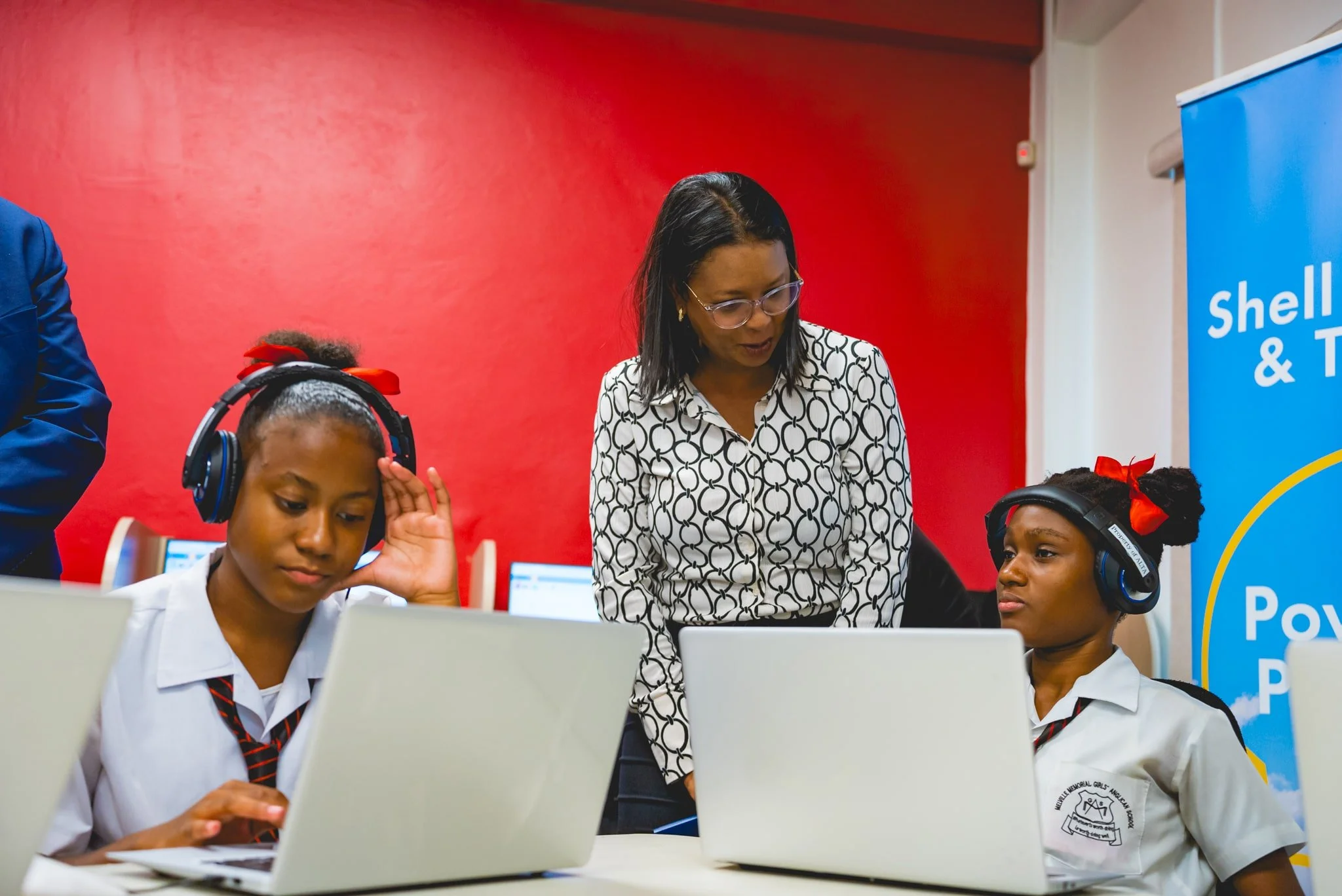  Simone David, Finance Manager, Shell T&T, joins two students at the ALTA Online Student Hub in Belmont on 14th May, 2025. 