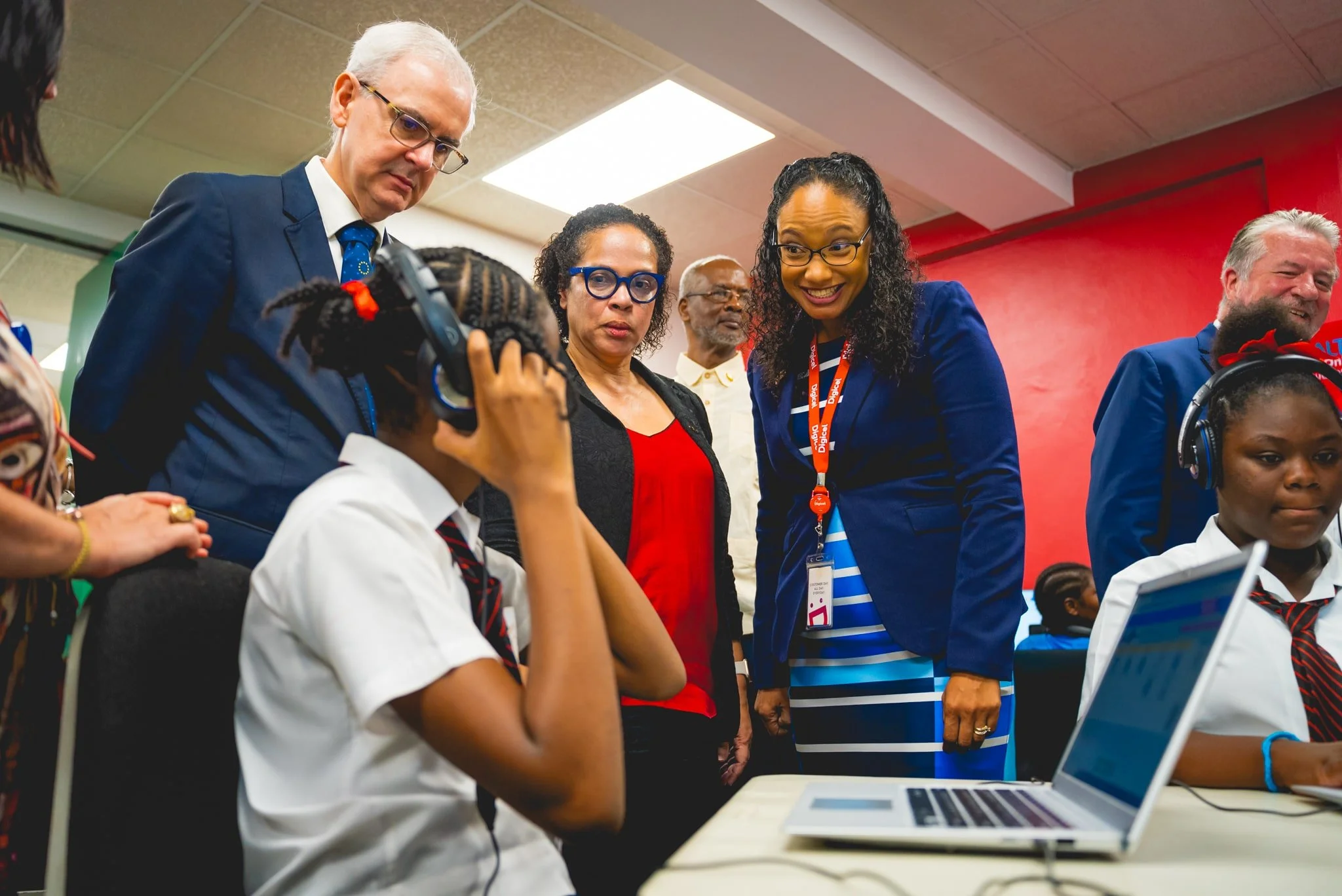  This student eagerly shares her ALTA Online learning progress with Digicel Foundation Director Romona Boiselle-Romano (on the right), in the company of H.E. Peter Cavendish, Ambassador, Delegation of the European Union, and ALTA’s CEO, Arlene Wallace-Romero.   