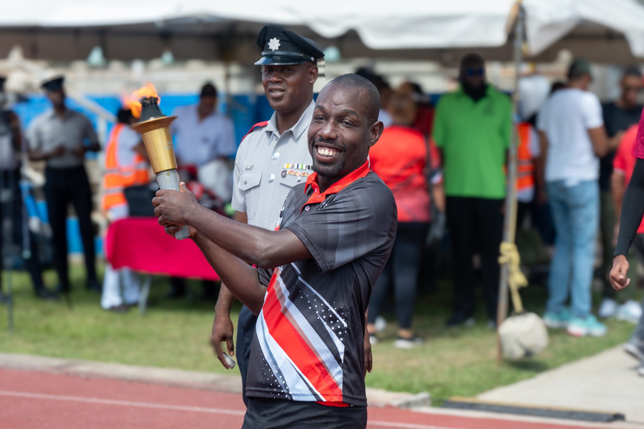 Nathan McLean from the Memisa Centre carries the traditional torch
representing peace, friendship, and the continuation of the Olympic spirit.