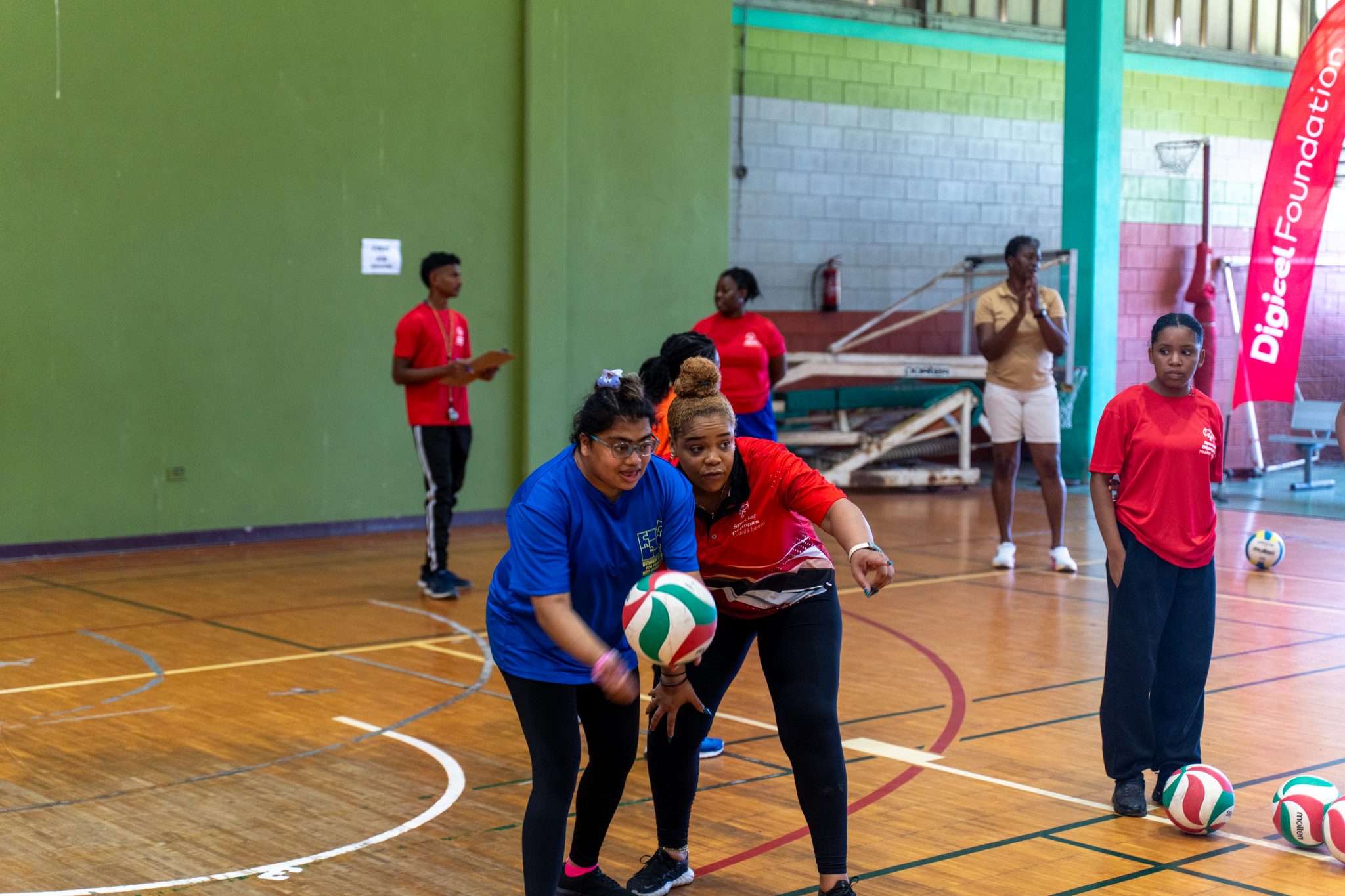 Coach Candace Young (right) polishes game strategy and technique with
Kristy Charan (left) from the National Centre for Persons with Disabilities.