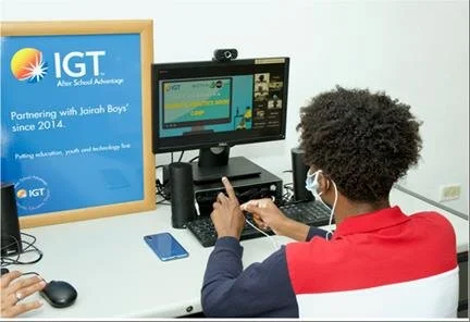  One of the young boys from Jairah Boys’ (Raffa House) pays close attention during the Opening Day of the IGT Coding and Robotics Rock Camp. 