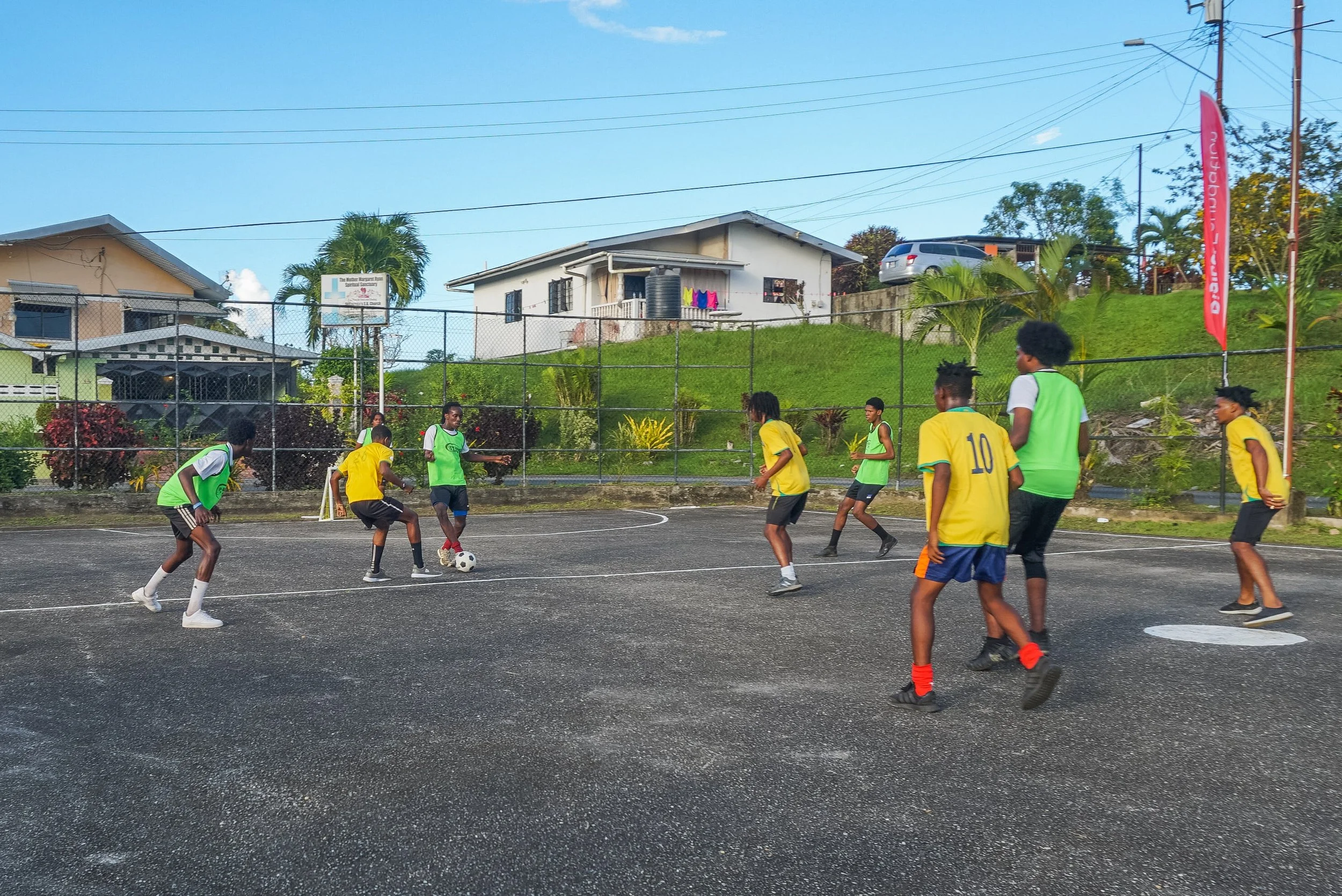Young men from the community participate in a football fete match which formed part of celebrations for the unveiling of upgrades to the Delhi Road Recreational Grounds.