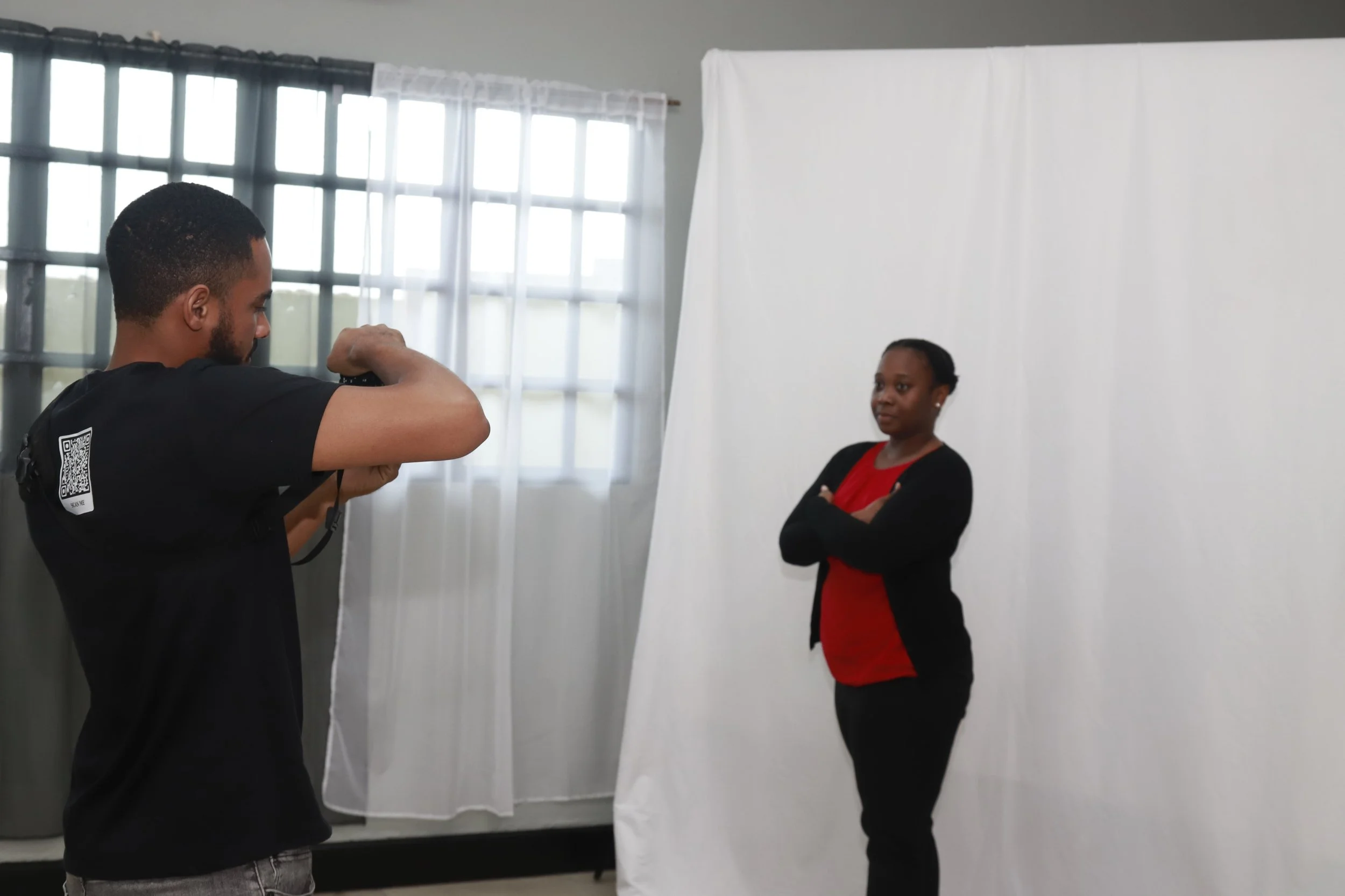 Akeiya Stapleton poses for a professional headshot image at the Development Hub.