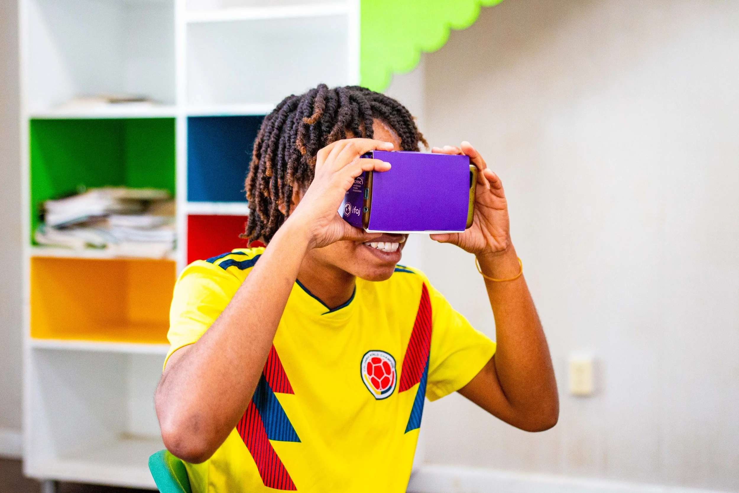 This young lady uses one of the affordable VR headsets to have an immersive experience.