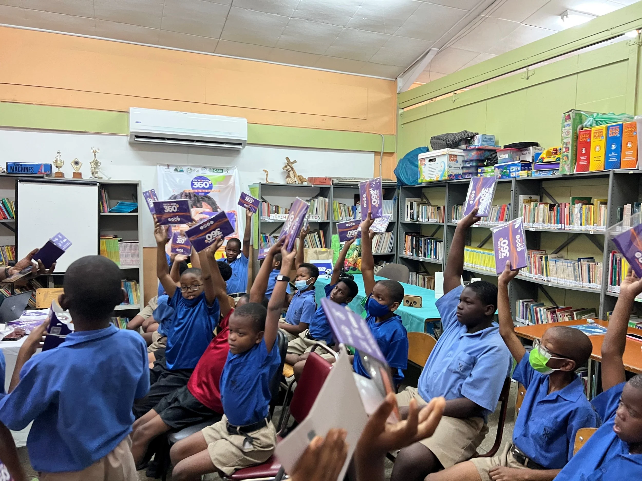 These youngs boys from Tunapuna RC were very excited to receive their VR headsets.