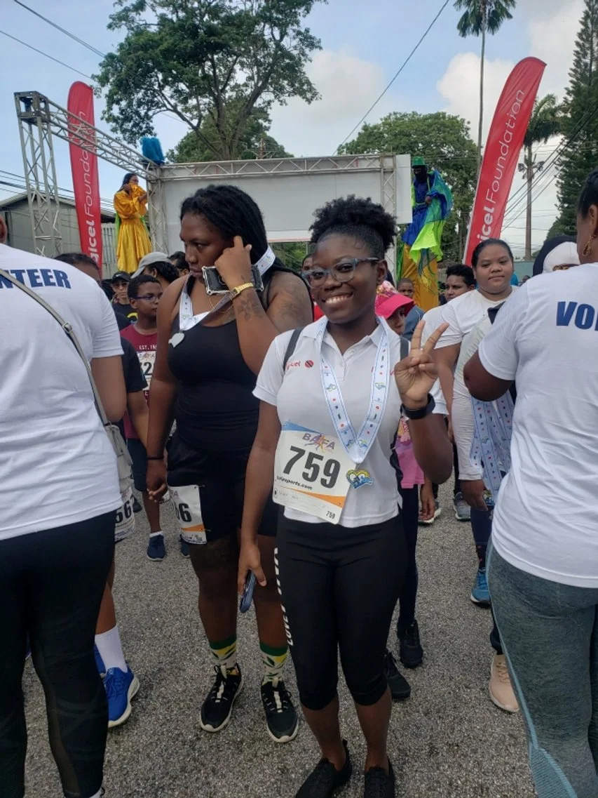 Participants set off on the Down Syndrome Family Network's 2023 Buddy Walk from Nelson Mandela Park after an energetic warm-up with moko jumbies and music.