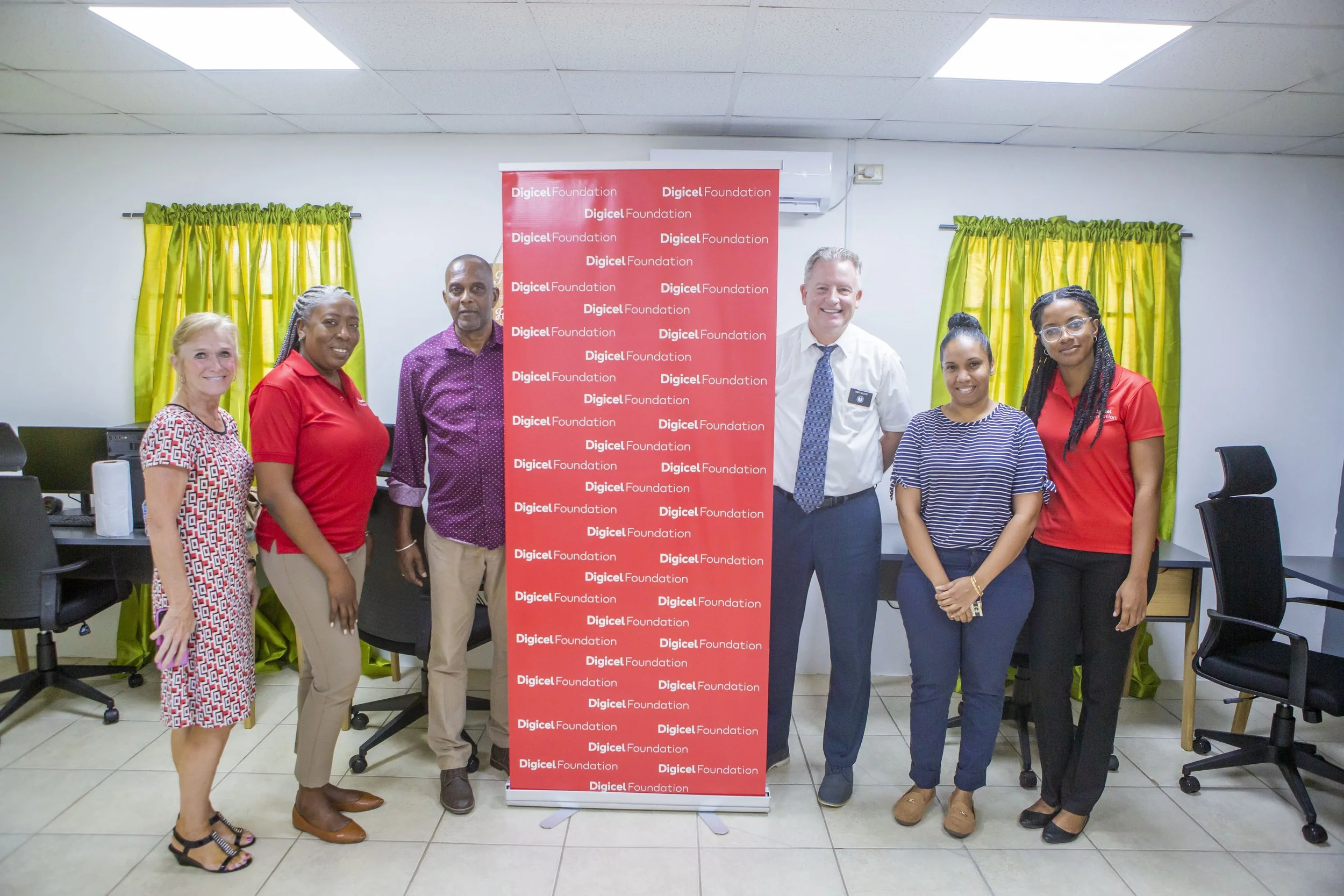 (L-R) Diane Sellers, Humanitarian Missionary for Latter-day Saint Charities (LDSC); Natalie-Anne De Silva, Project Consultant at the Digicel Foundation; Robert Ward, Addiction Counselor at the New Life Ministries Rehabilitation Centre; Kory Sellers, Humanitarian Missionary for LDSC; Patrice Dookie, Therapist at the New Life Ministries Rehabilitation Centre; and Misha Jackman, Finance Accountant at the Digicel Foundation, launch the tech space at The New Life Ministries Rehabilitation Centre in Palo Seco.