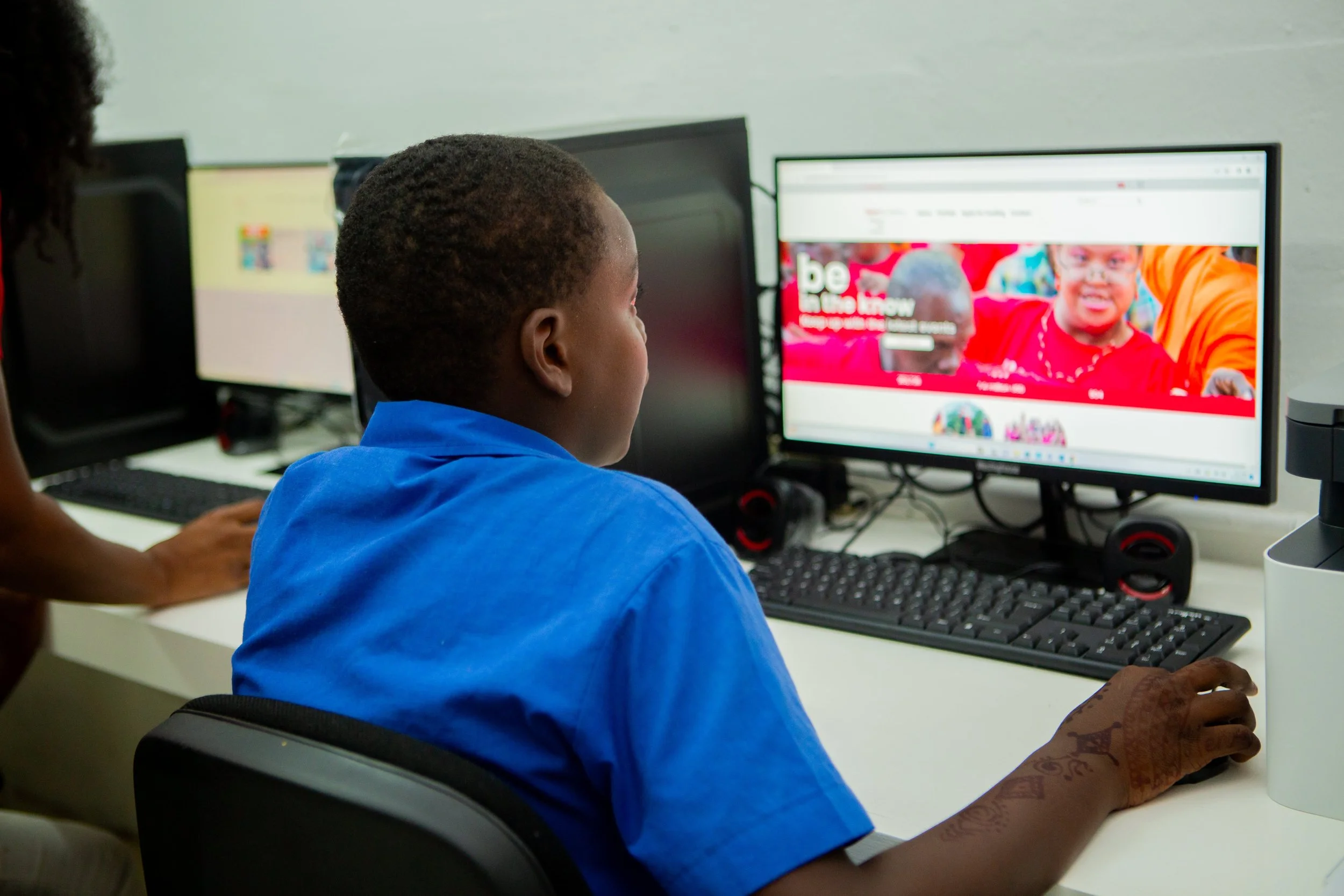 This primary school student is one of the first to use the computer lab at the upgraded Dass Trace Youth Empowerment Centre at the official reopening on 9 November 2023.