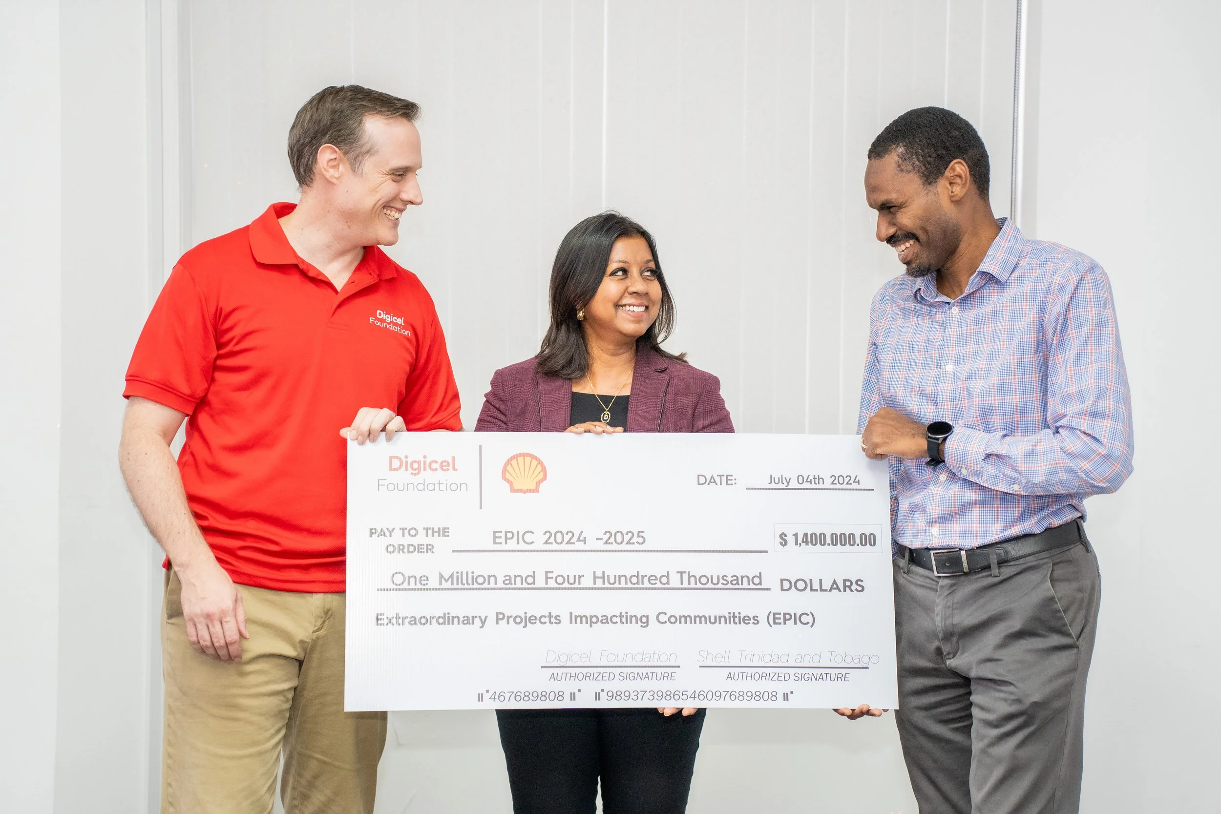  Partnering for community transformation: From left to right, Abraham Smith, CEO, Digicel Trinidad and Tobago; Desha Clifford, Chairperson, Digicel Trinidad and Tobago Foundation; and Burt Bushell, Work Process Performance Manager, Business Transformation, Shell Trinidad and Tobago. 