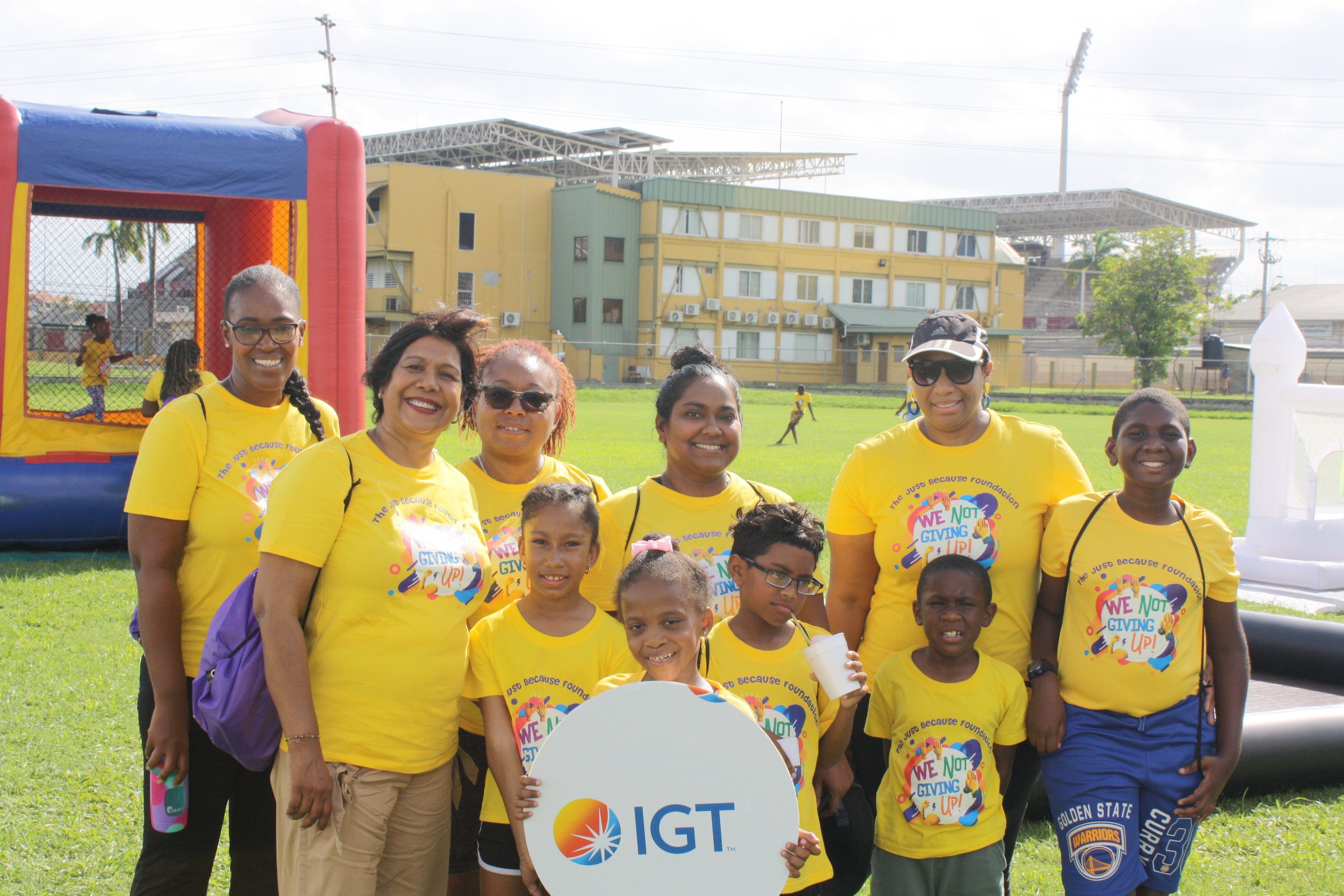 IGT staff and family members proudly display their JBF ‘Kiddie K’ t-shirts to raise awareness of childhood cancer.