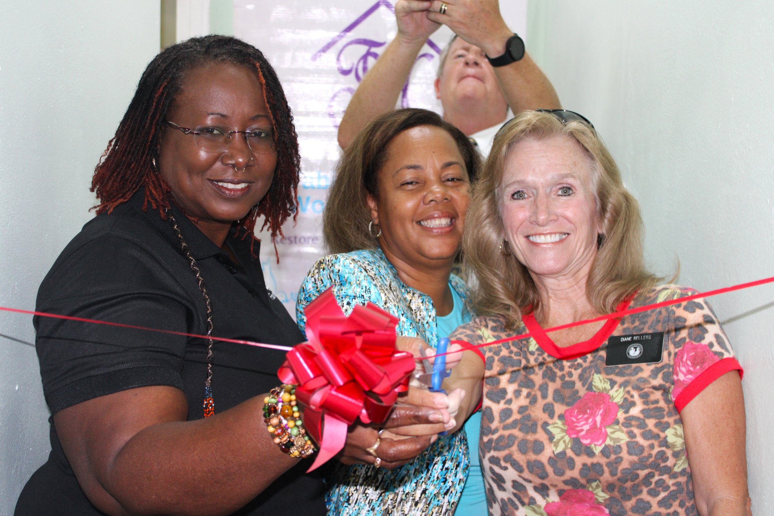 (Left to Right) Georgina Peterkin, Digicel Foundation Director; Rowena Martineau-Pitt, President of Tabitha’s Home for Women and Children, and Diane Sellers, Humanitarian Missionary for The Church of Jesus Christ Latter-day Saint Charities (LDSC), cut the ribbon on the new self-contained apartment units at Tabitha’s Home for Women and Children in Tobago on Friday 22 November.