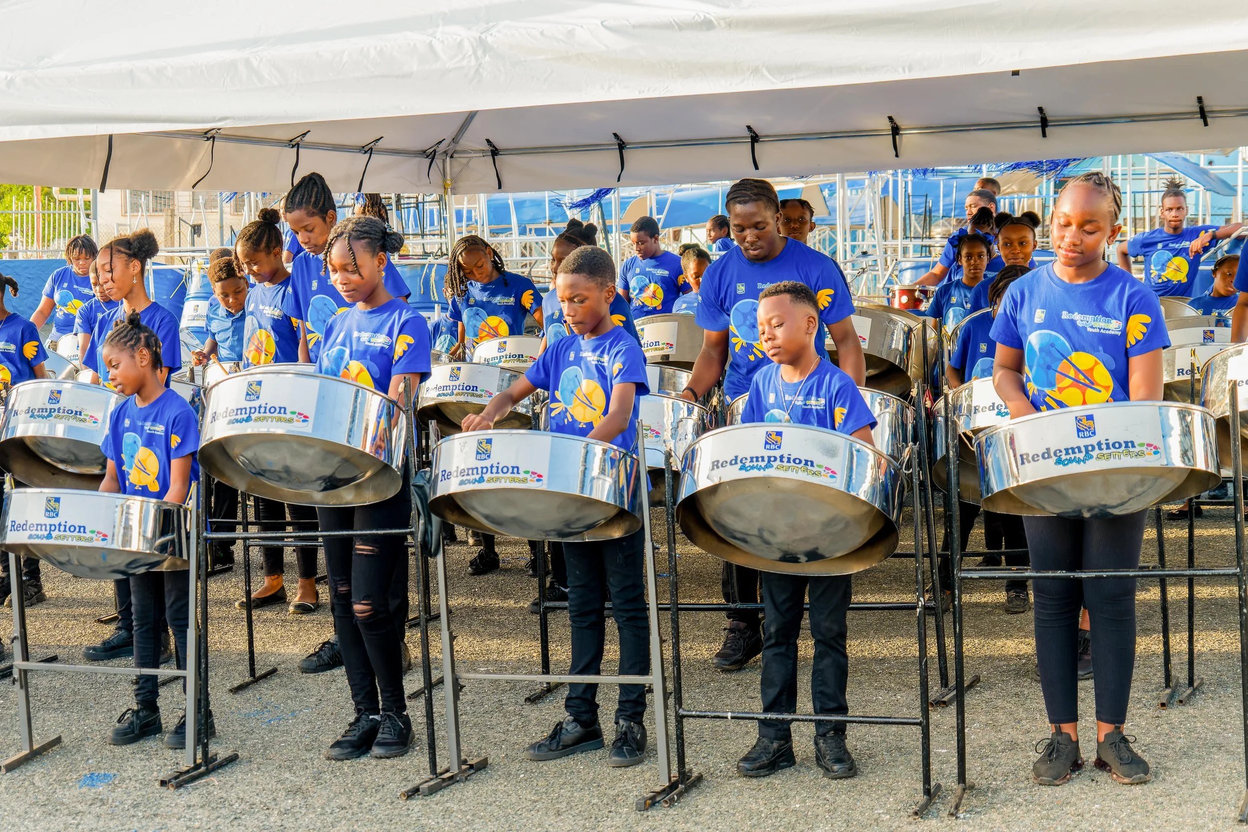  Youth members of RBC Redemption Sun Setters in Tobago celebrate the launch of the Panyard's new Technology in Education (TIE) Centre, 27 March.    