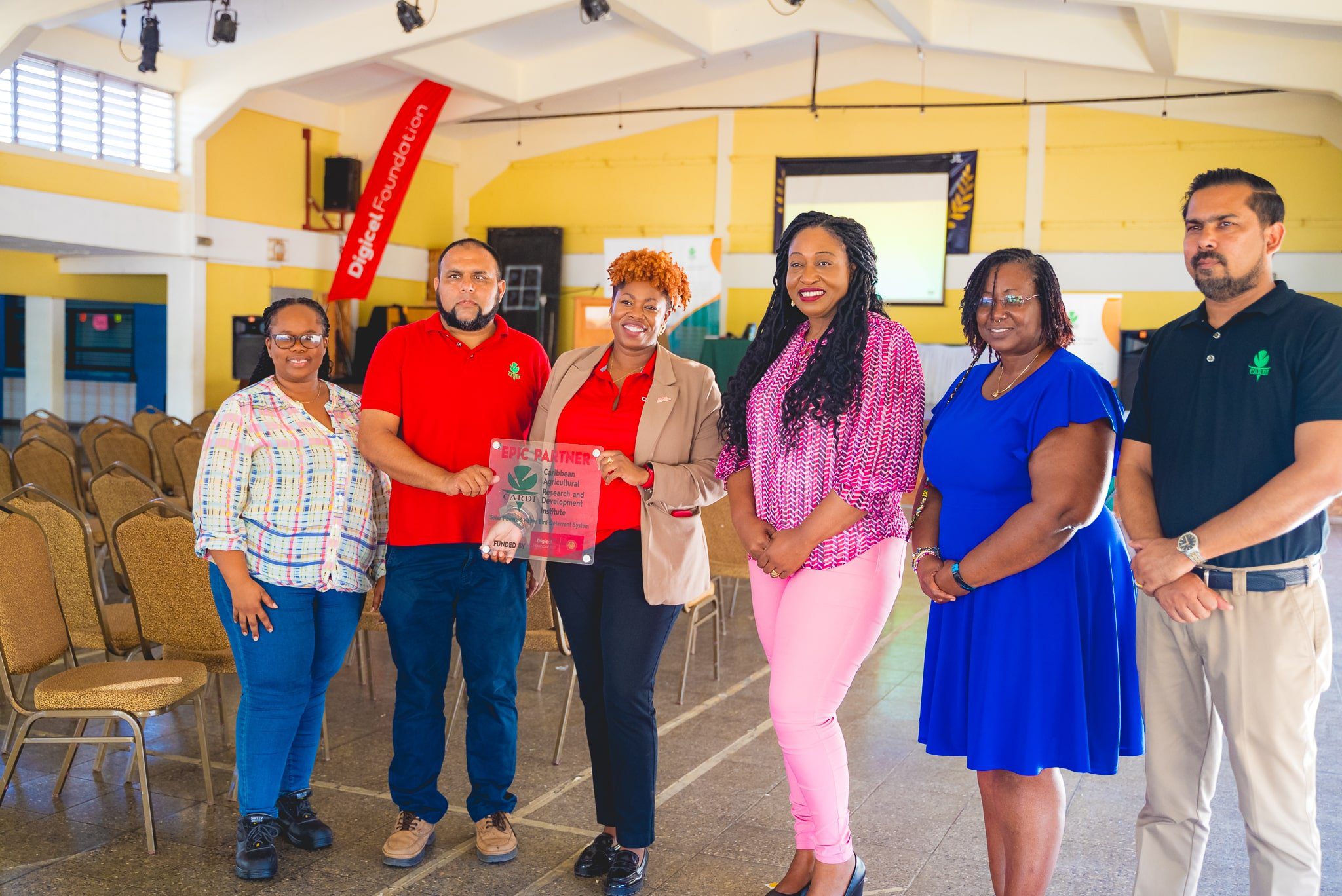  L-R) Tamika Seales-Monsano, Director Food Crop Production, CARDI; Fayaz Shah, Manager of Science Technology and Innovation, CARDI; Cindyann Currency, Head of Operations, Digicel Foundation; Assemblyman Nathisha Charles-Pantin; Georgina Peterkin, Digicel Foundation Director; and Ansari Hosein, Executive Director, CARDI at the launch of the Bird Wailer System at Goodwood Secondary School, Tobago, on March 12 2024. 
