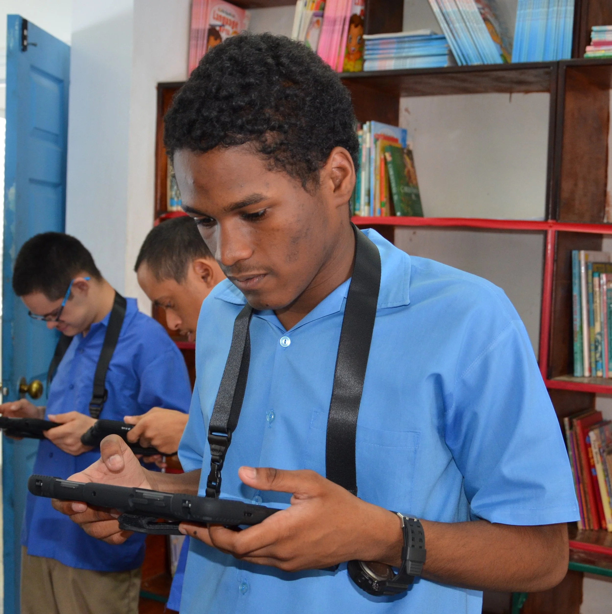 Students use the new tablets donated to the Immortelle Centre through the IGT ASA Programme.