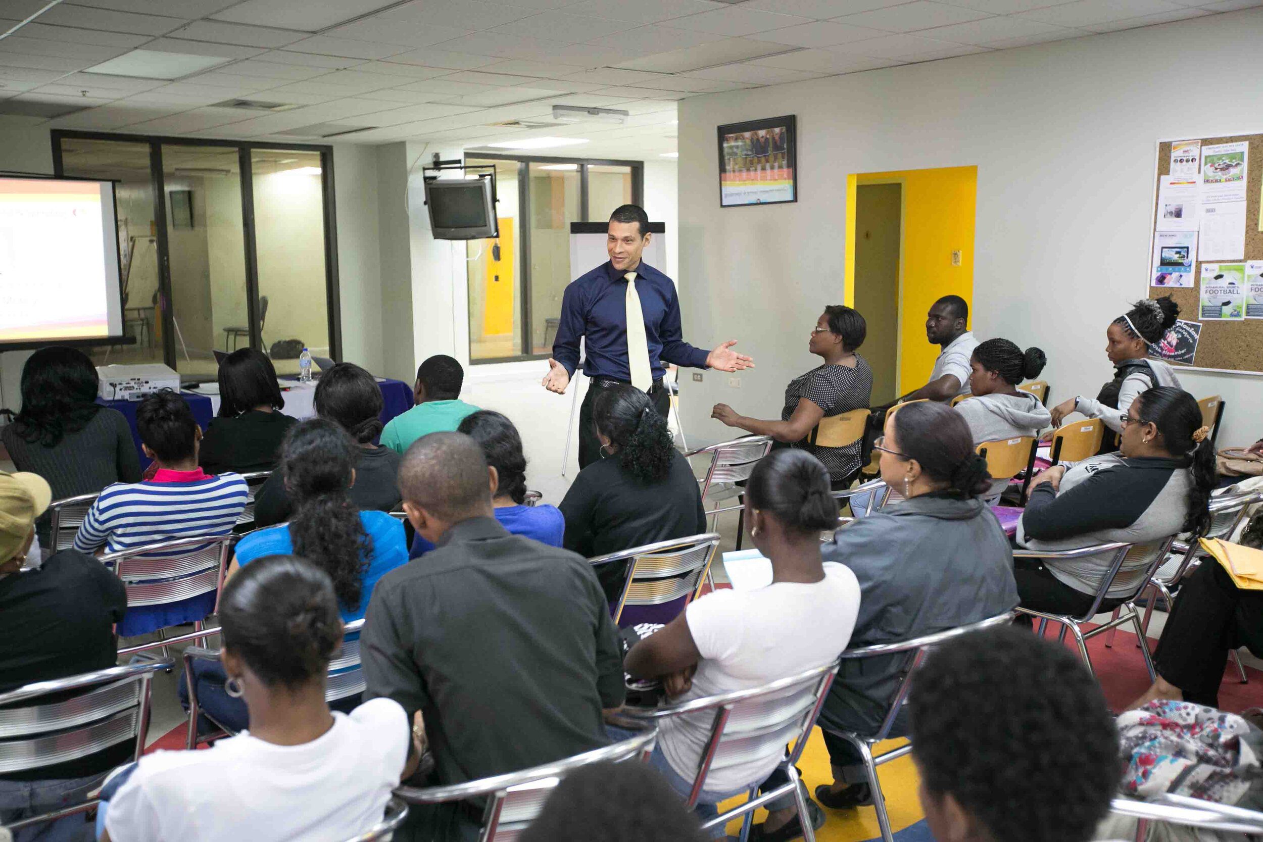 Local Financial Coach, Trainer, Advisor and Author, Nicholas J. Dean delivers his lecture on Financial Literacy - Developing Responsible Spending Habits at the inaugural MasterCard Lecture in Trinidad & Tobago at COSTAATT