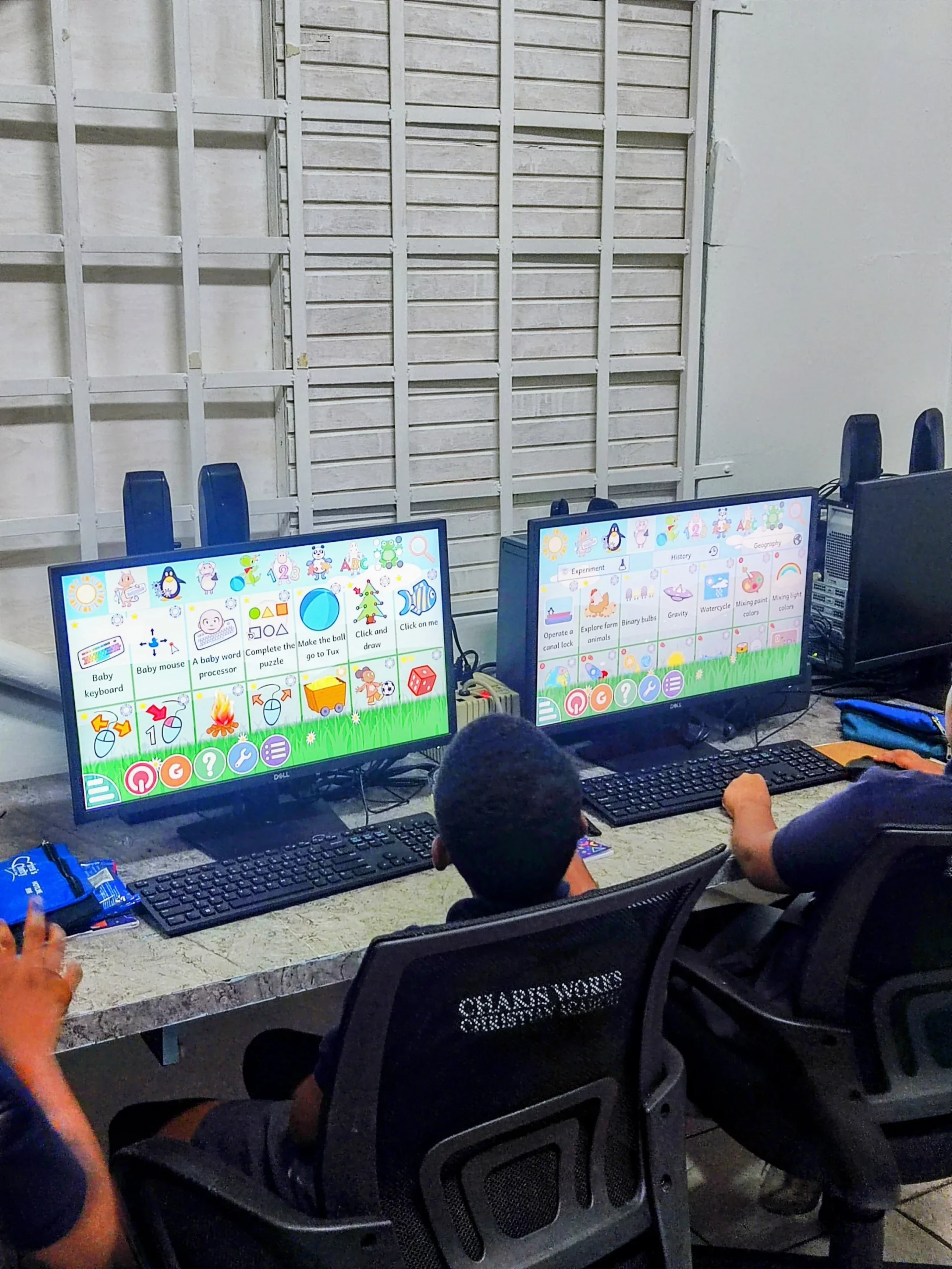  Pushing through another lesson at their own pace, these boys make the most of the Digicel Foundation Innovation Lab at their school. 