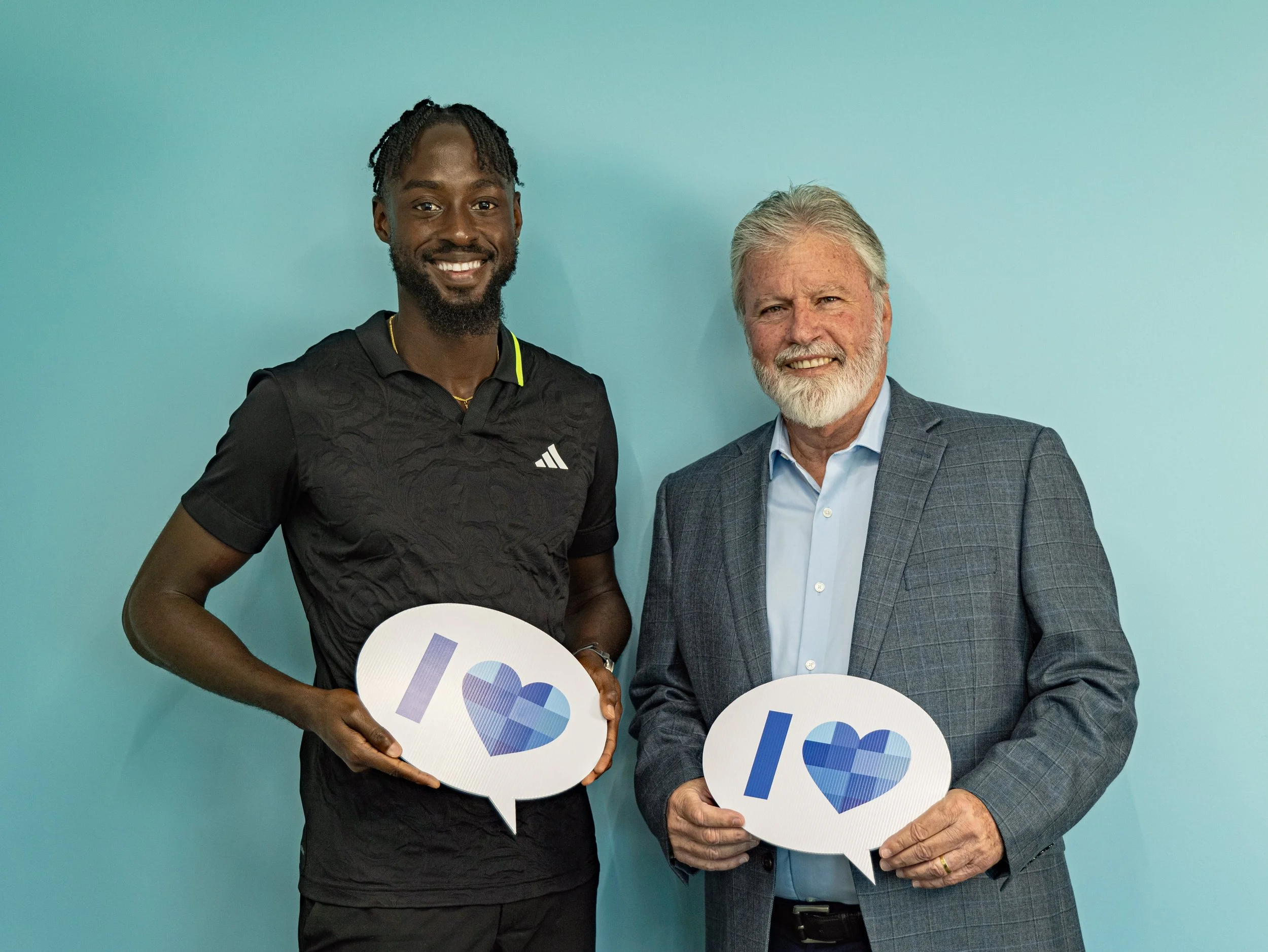  (L-R) T&T’s Track and Field Olympian   Jereem Richards with Michael Conyers, Deputy Chairman of The Brydens Group. 
