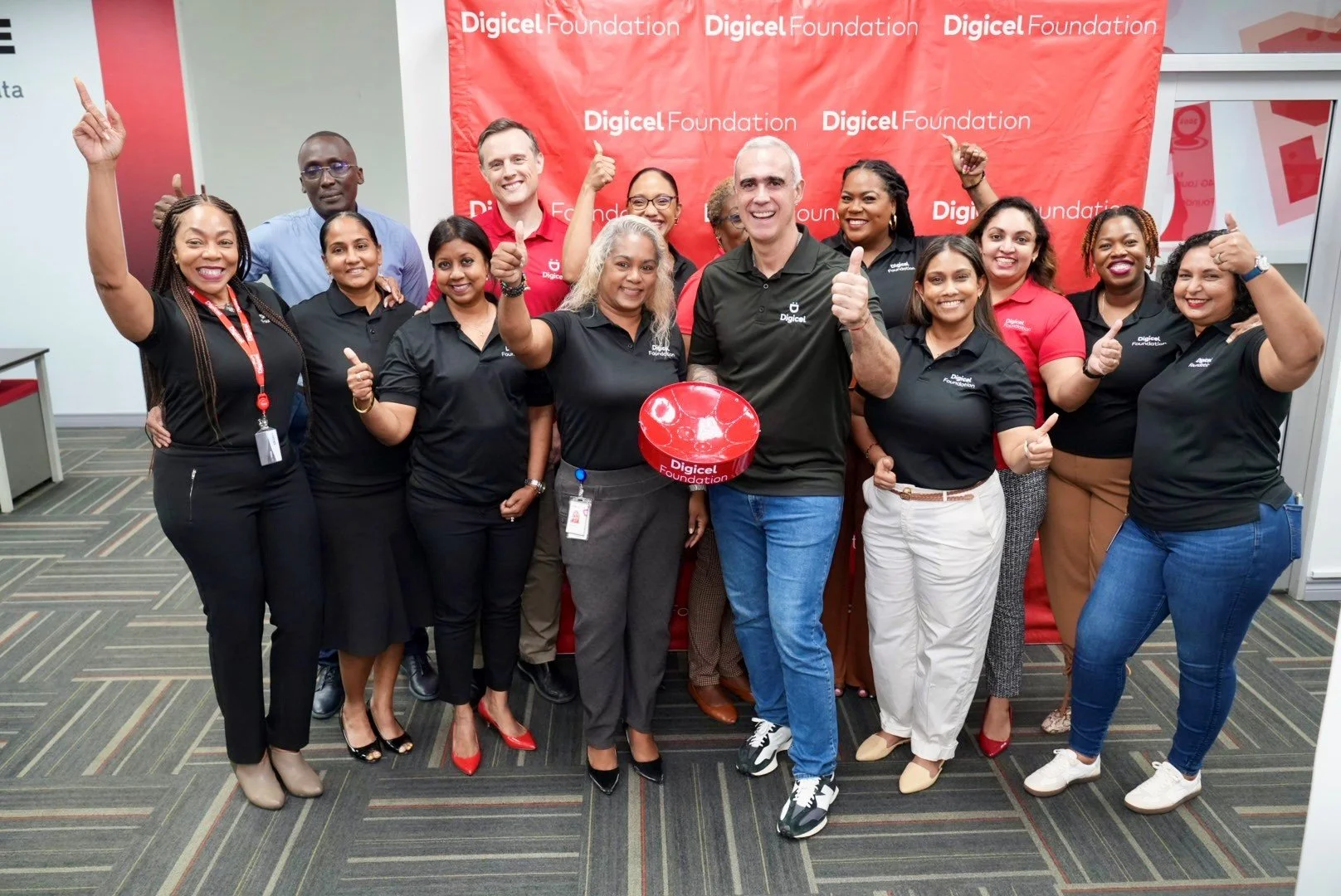 The Digicel Foundation Board of Directors and staff pose for a group shot with Digicel Group CEO Marcelo Cataldo on his visit to Digicel Trinidad and Tobago headquarters, Port of Spain, in July 2024.