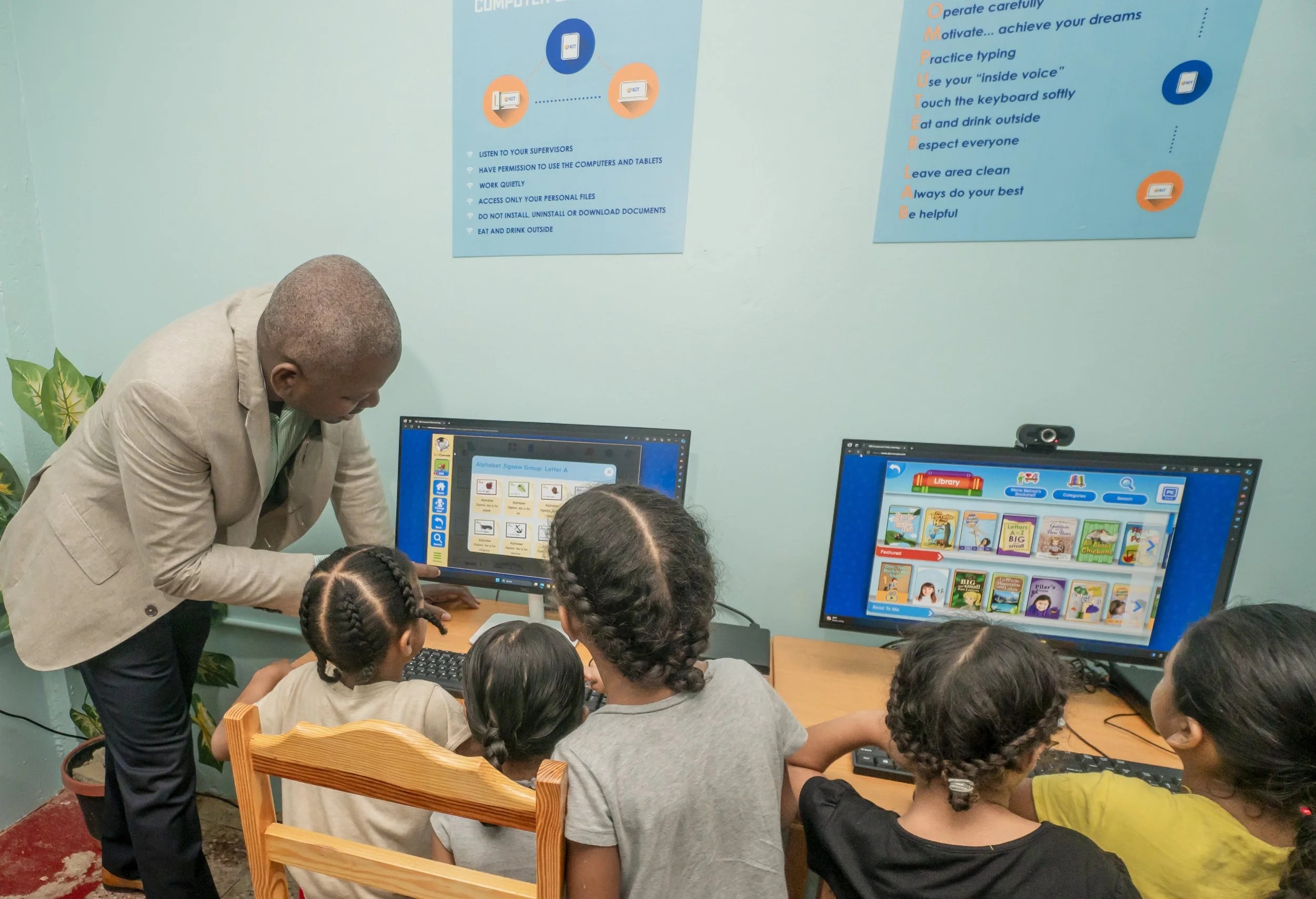 Deeply engrossed and enjoying digital learning with the help of Dexter Thomas, IGT’s General Manager Trinidad and Tobago, these Amica girls couldn’t be happier!