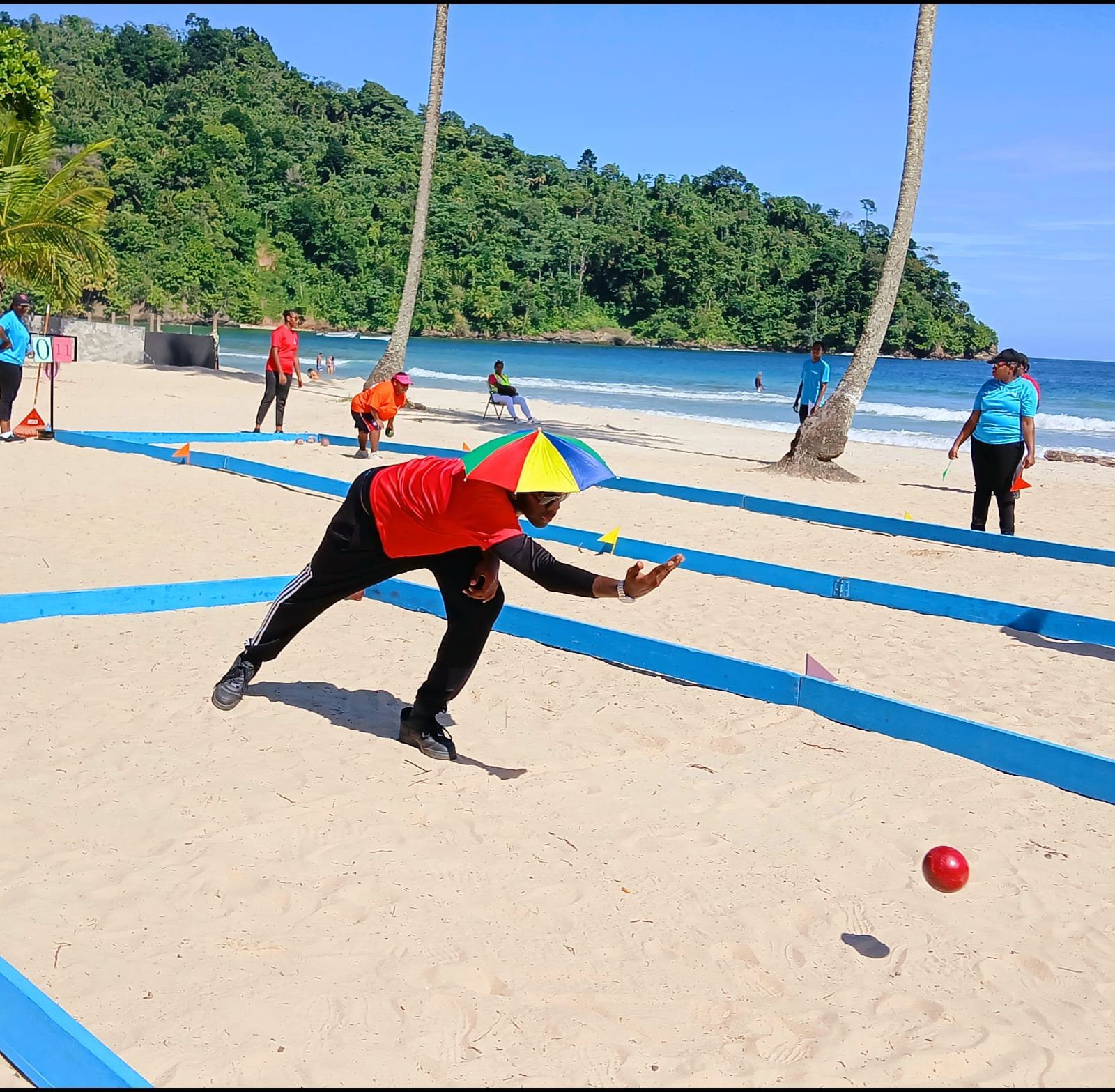 : Bocce in the blazing heat: This athlete keeps his eye on the ball in the Bocce competition at the Special Olympics Regional Beach Games at Maracas Beach.