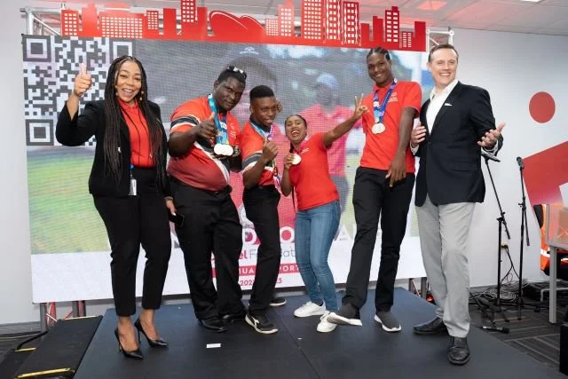  Digicel Foundation CEO Penny Gomez (far left) and Digicel TT CEO Abraham Smith (far right) celebrate the year’s successes with athletes from the Special Olympics Trinidad and Tobago (from left to right) Malachi Sylvester, Cadell Cuffy,  Victoria Samuel and Omari Patterson at the Digicel Foundation’s AGM on 26 July 2023.  