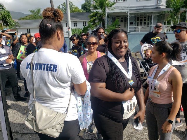 Participants relax with friends and family after completing the 2023 Buddy Walk to raise awareness about Down Syndrome on Sunday 22 October 2023.
