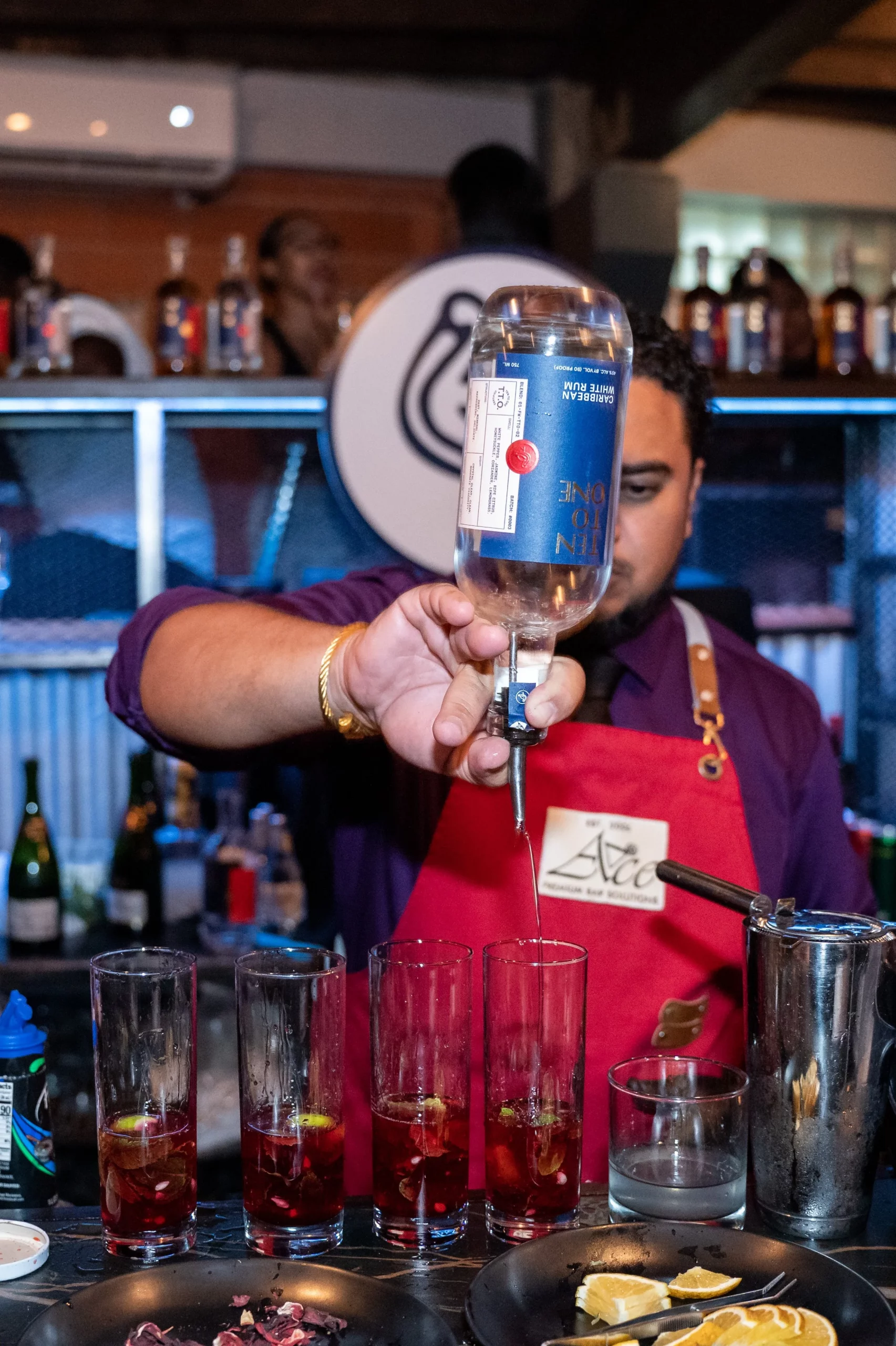  A mixologist creates cocktails using Ten to One White Rum at the brand’s Friday Night Lime at District Cafe, Woodbrook, on 23 June.  