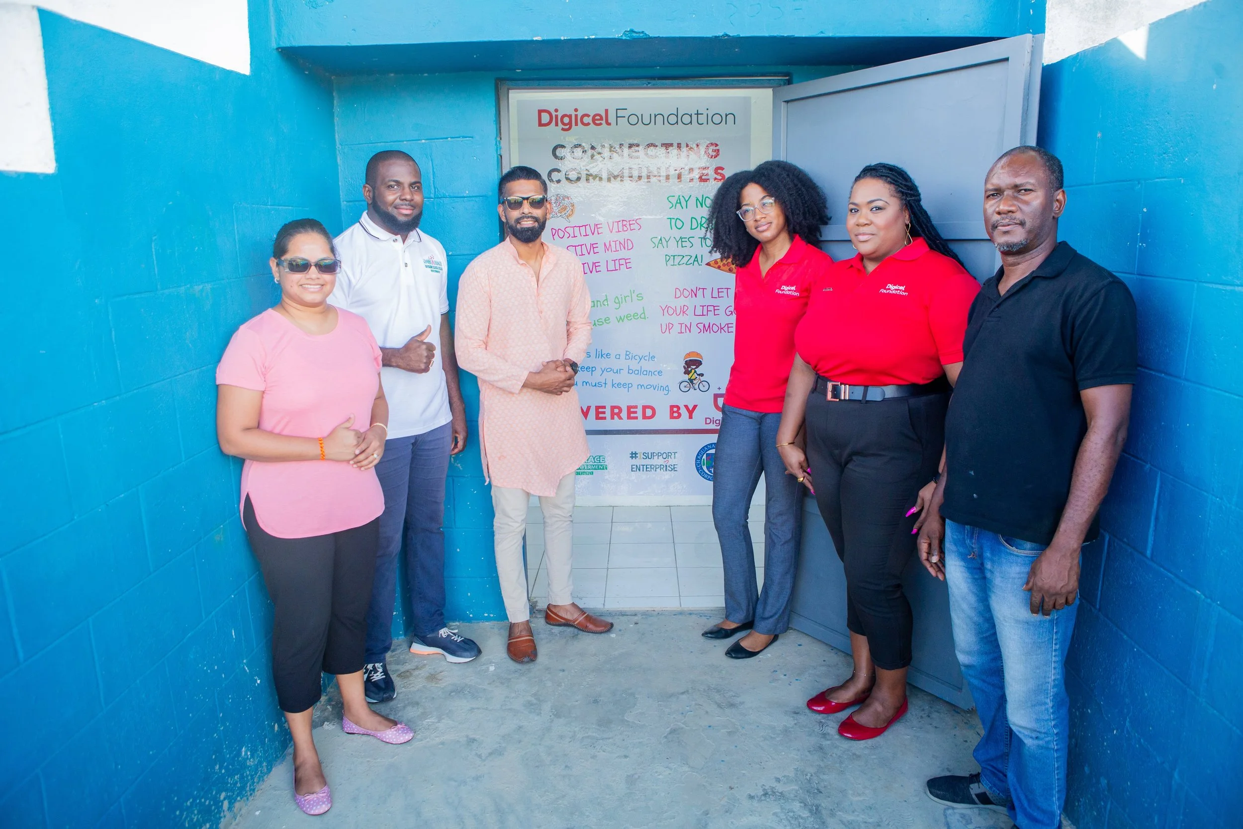 (L-R) The Honourable MP for Chaguanas East, Vandana Mohit; President of the Dass Trace Youth Empowerment Committee, Justin Lewis; His Worship The Mayor of Chaguanas, Mr. Faaiq Mohammed; Misha Jackman, Digicel Foundation Finance Accountant; La Toya Gopaul, Digicel Foundation Director; and Rolston Decoteau, Chairman of the Dass Trace Youth Empowerment Committee, at the official reopening of the Dass Trace Youth Empowerment Centre on 9 November 2023.