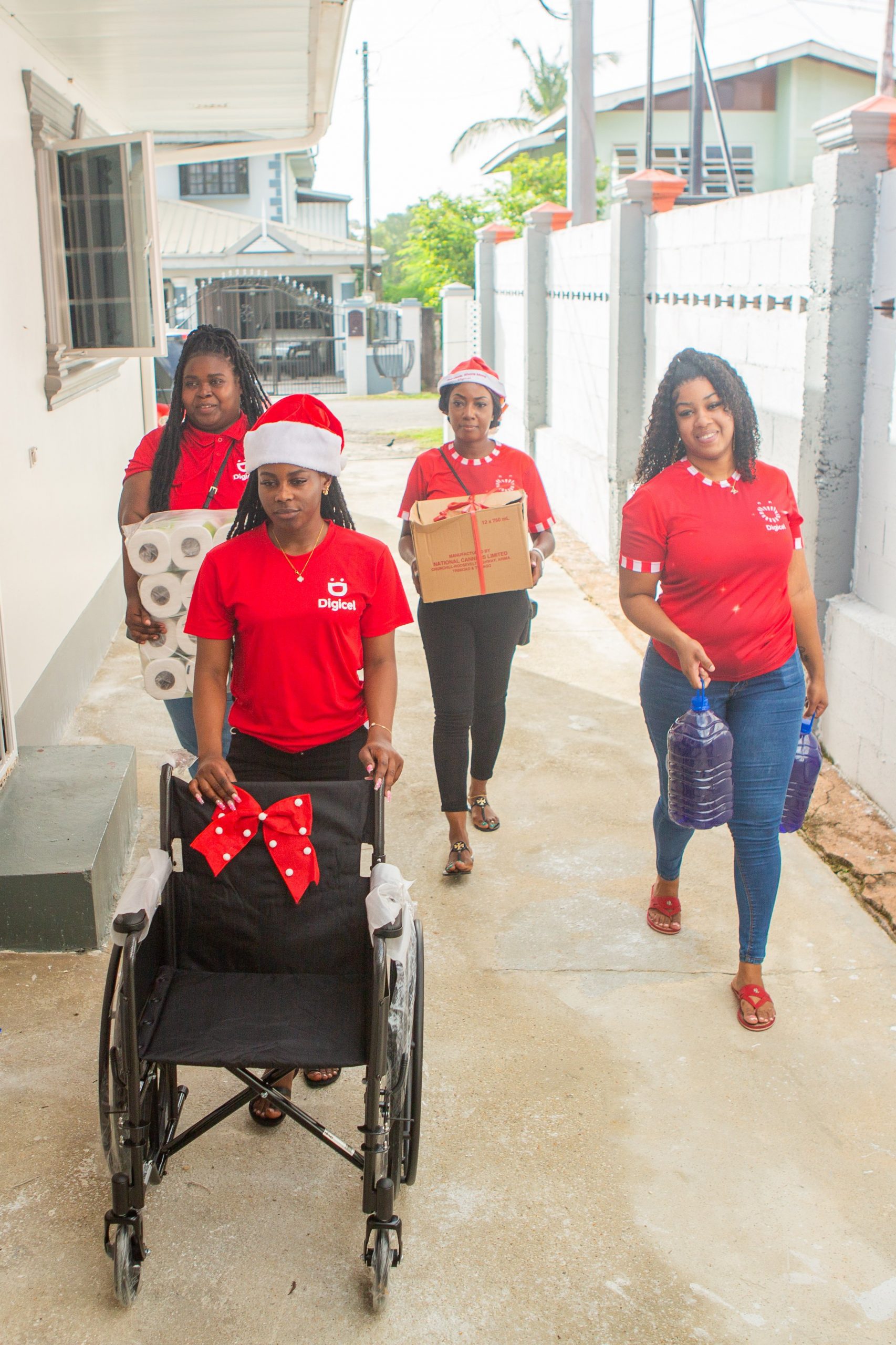 This Digicel Foundation Mobile Telesales Team get ready to Spread Christmas Cheer to the residents of Afeisha’s Home for the Aged courtesy the Digicel Foundation’s Community Grant via its Annual Christmas Campaign Staff Treasure Hunt!