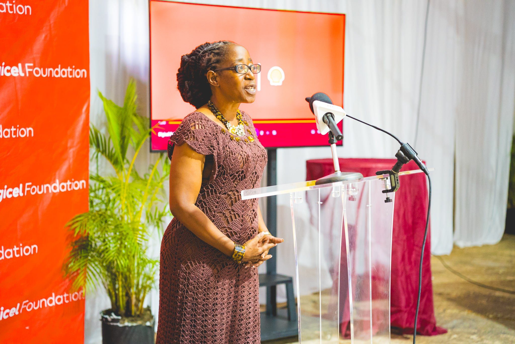 Rosemary Sandy, participant of the ‘Support Educate Empower Women’ (SEEW) programme shares her testimony at the launch of the Ryu Dan Empowerment Foundation’s Extraordinary Projects Impacting Communities (EPIC) project, funded by the Digicel Foundation in partnership with Shell Trinidad and Tobago (Shell). 