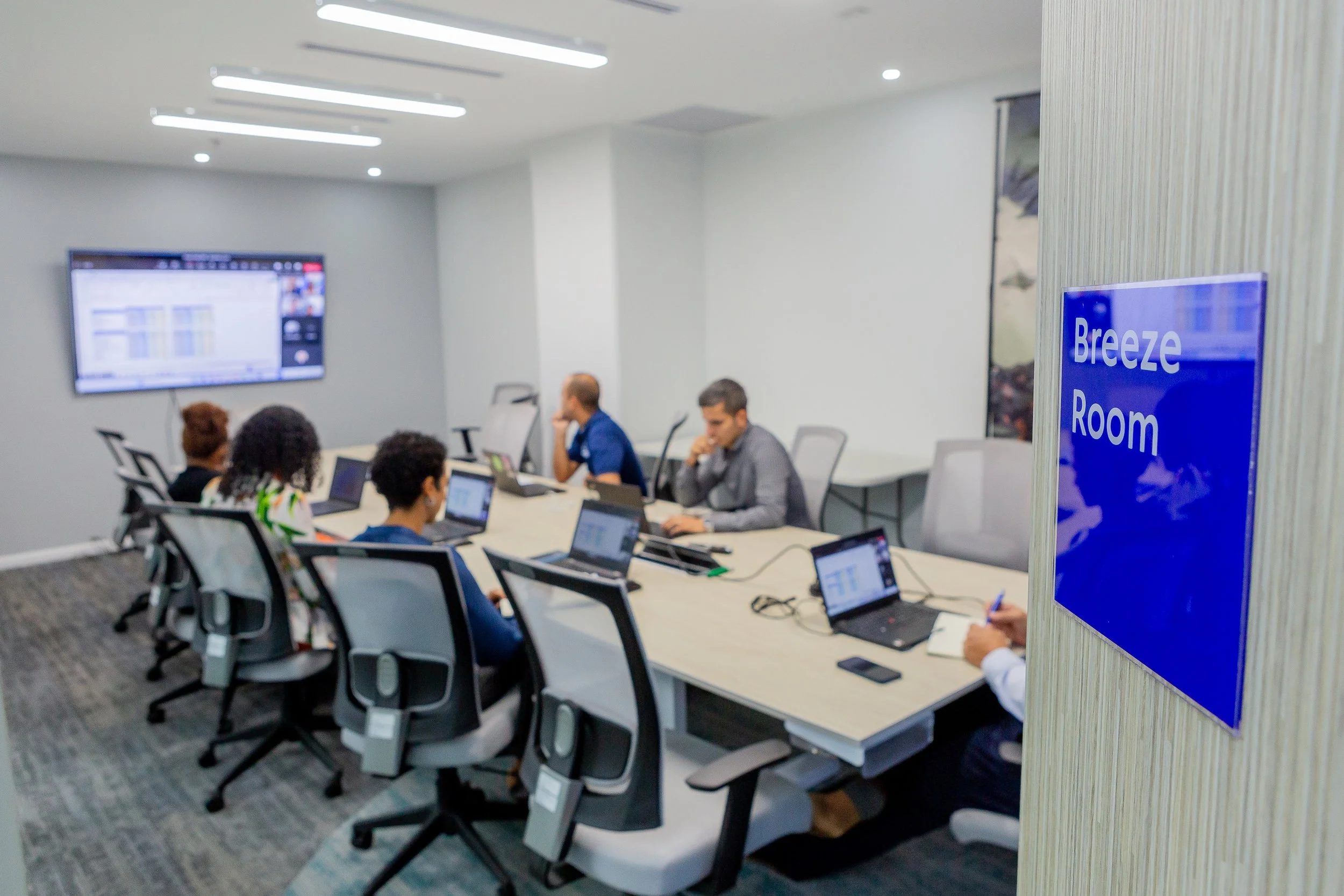 The Unilever team gathers in the boardroom of the new headquarters at Albion Plaza, Victoria Avenue, Port of Spain, for a virtual meeting with off-site colleagues.