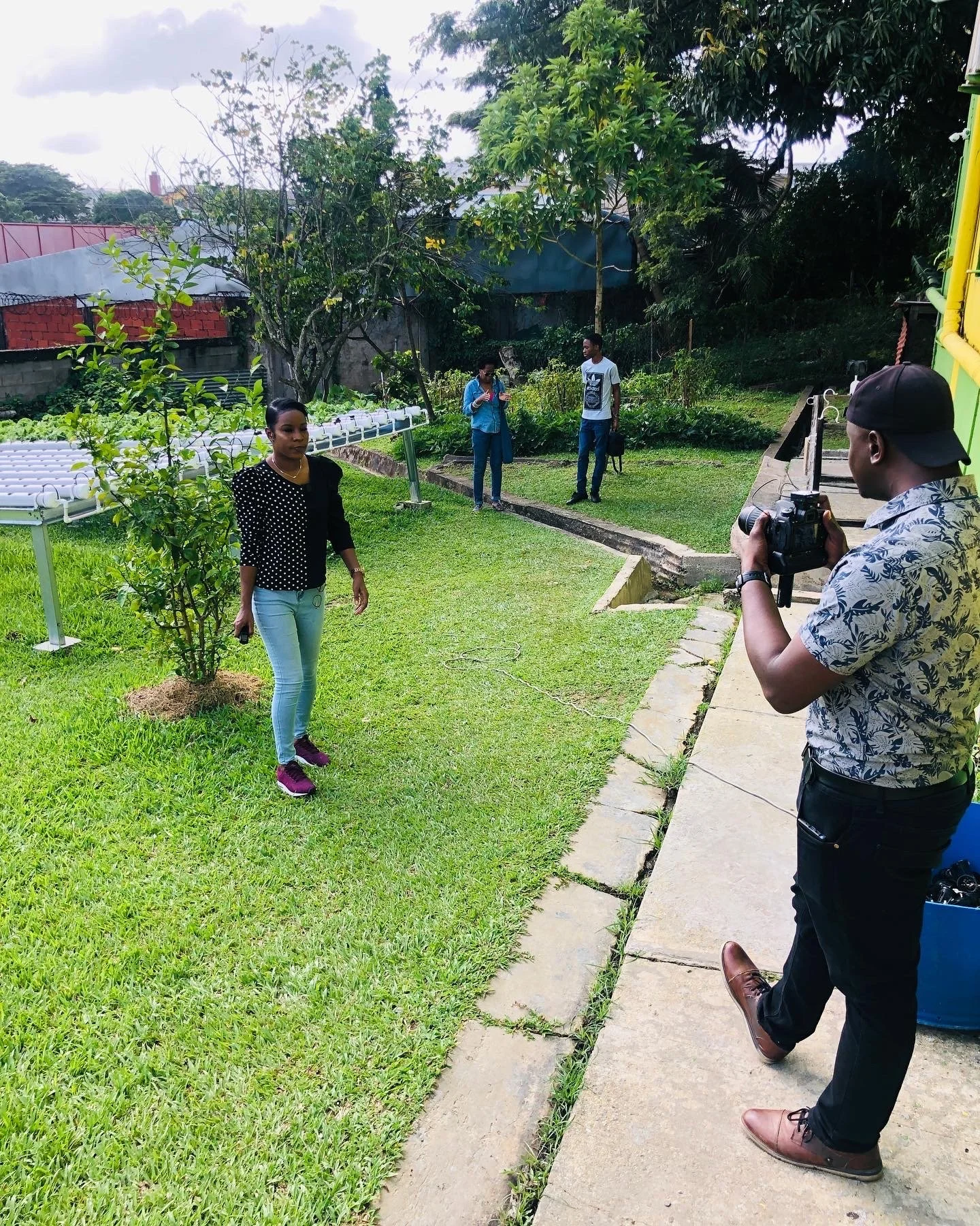 Runako Williams films Wavel Fraser from Tringlobe Media to document the project’s progress as the new hydroponics system is installed at Court Shamrock Home for Socially Displaced Men in San Fernando.