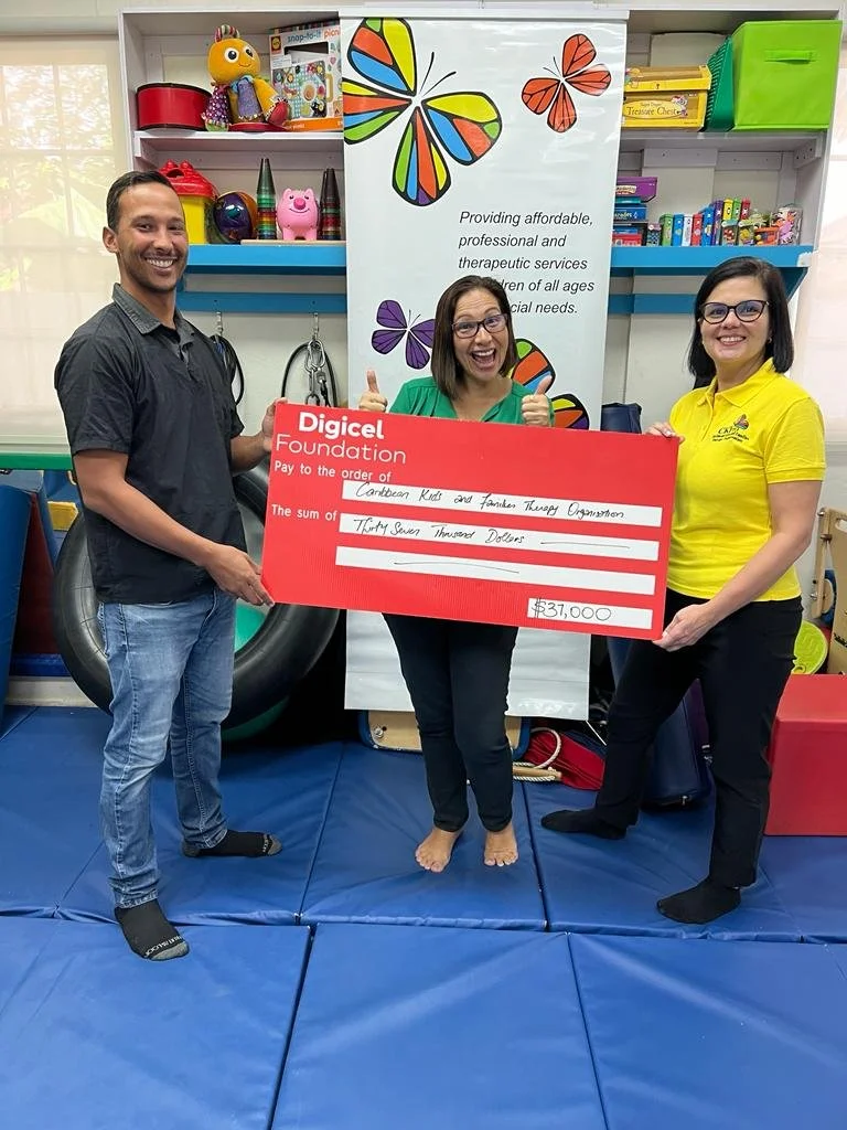 CKFTO Vice-Chair Sofia Figueroa-Leon (centre) and Occupational Therapists Christopher Ristic (left) and Carolina Calles Everdium (right) are thrilled to receive funding from The Digicel Foundation toward the cost of further training, purchase of ADOS testing kits and conducting assessments to diagnose Autism Spectrum Disorder (ASD).
