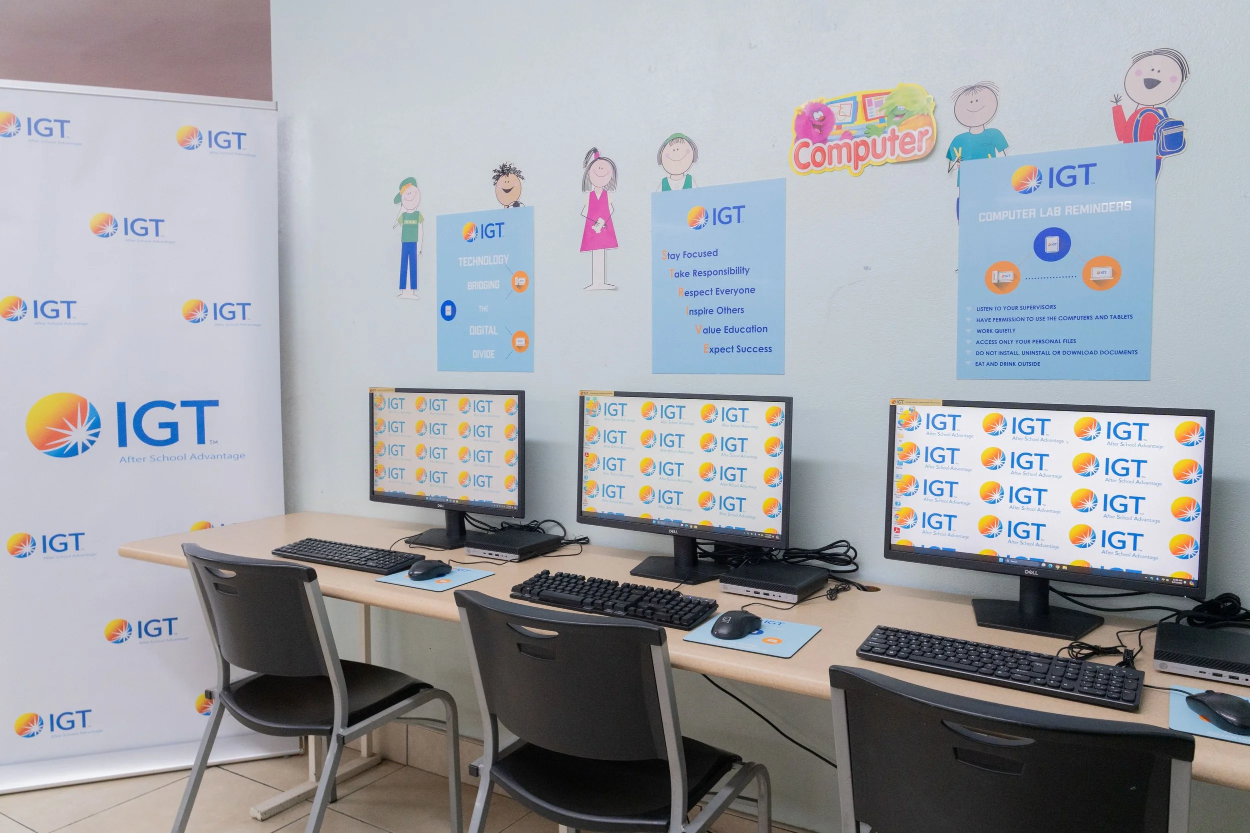 Three of the four newly installed desktops at the Credo Drop-in an Outreach Centre on Nelson Street, Port of Spain, donated through the IGT After School Advantage community initiative.