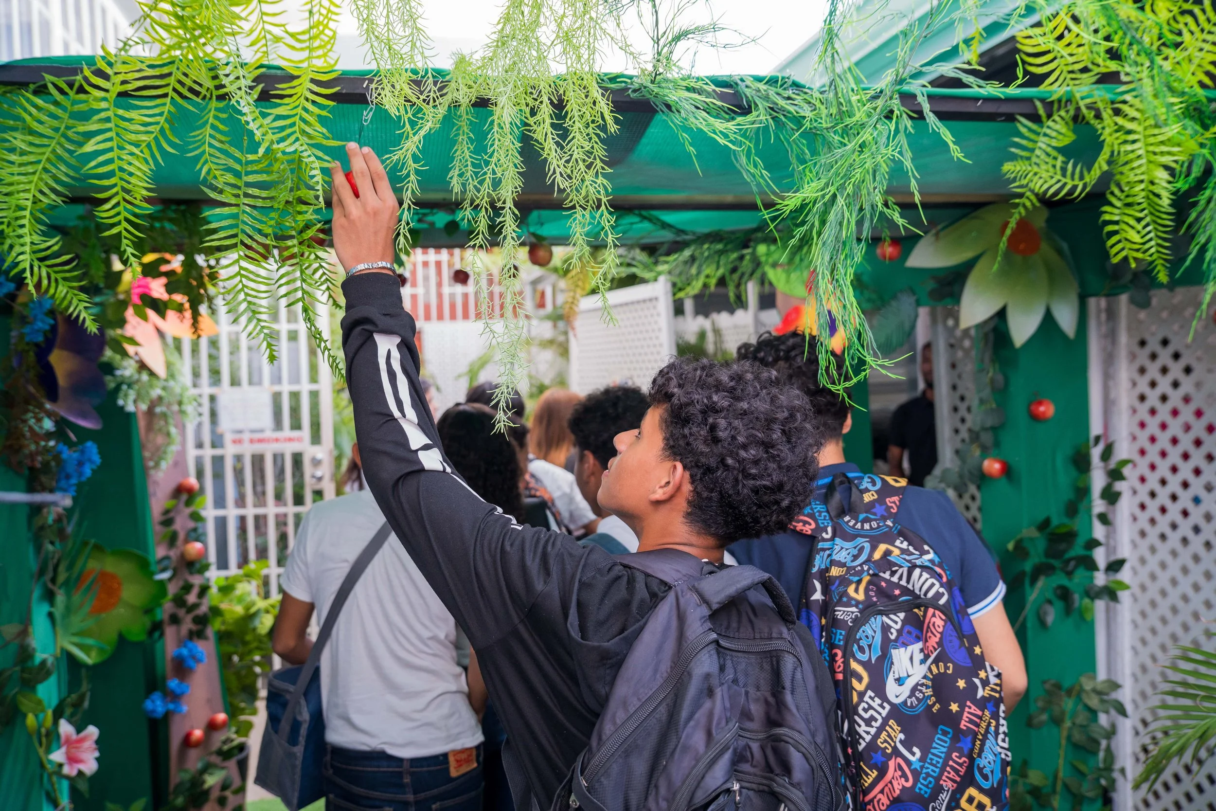 Students explore a sensory garden as they enter the storytelling room.