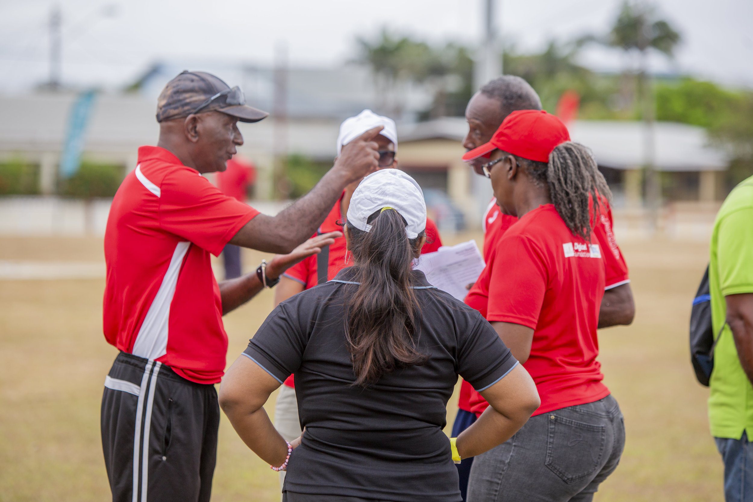  Engrossed in strategy, coaches and team members discuss their next play during the Special Olympics National Cricket Games on Saturday 16th March 2024. 