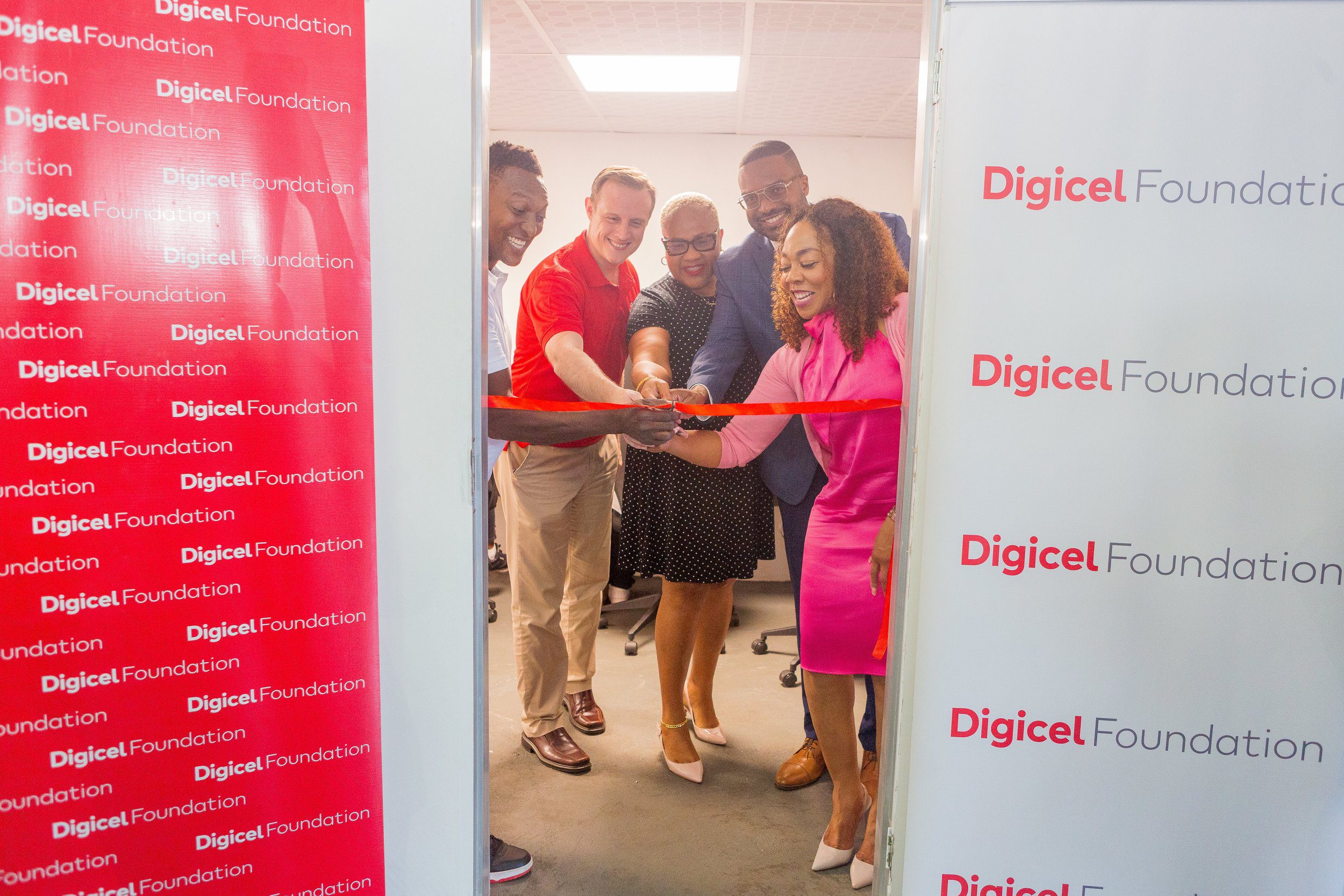 Ross Thomas, Captain of Pandemonium Steel Orchestra, Abraham Smith, CEO Digicel Trinidad and Tobago & Board Director of the Digicel Foundation, Desiree Myers, Chairman Northern Region PanTrinbago, His Worship Chinua Alleyne, Mayor of Port of Spain and Penny Gomez, CEO Digicel Foundation cut the ribbon on the Technology in Education Centre at Pandemonium Panyard in Belmont on Wednesday 28 February.