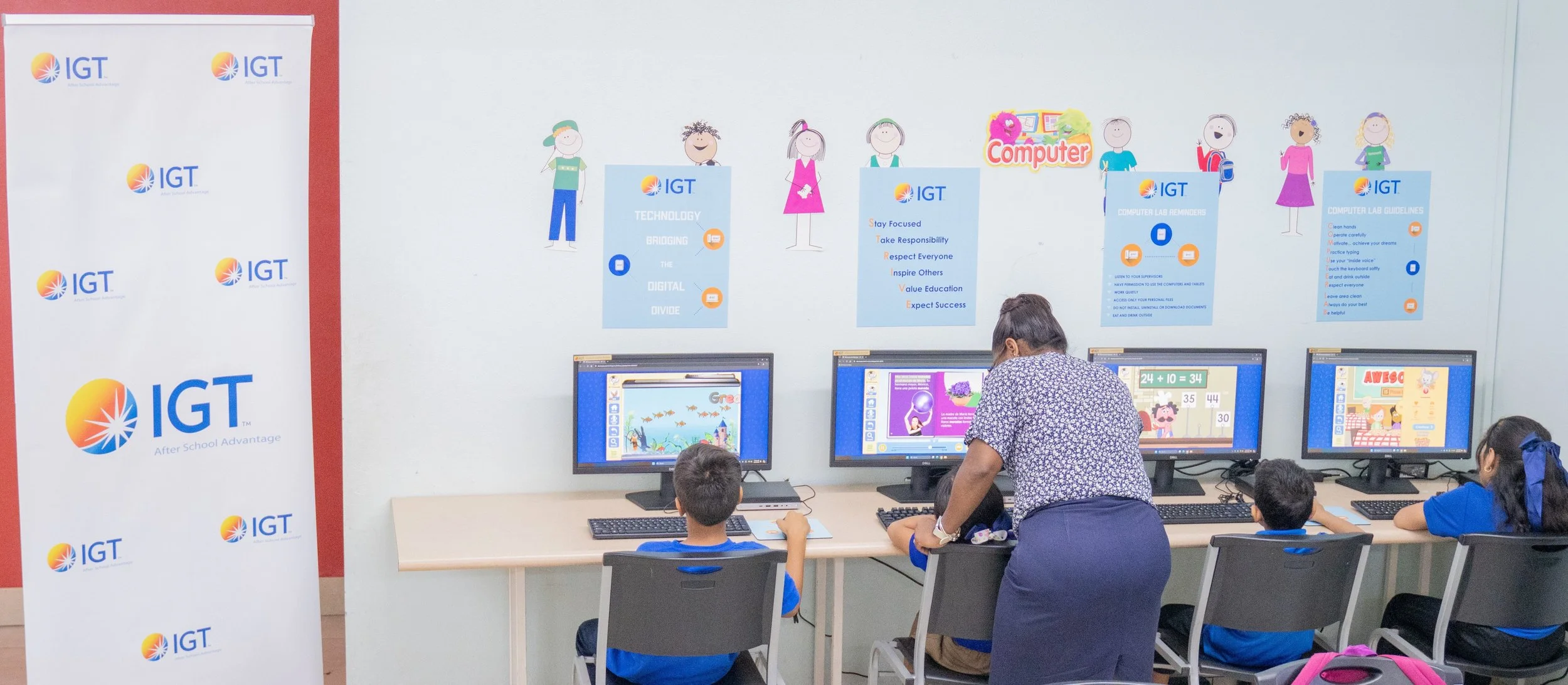 Ready to learn! These students are fully engaged using interactive educational software at the Credo Drop-in and Outreach Centre.