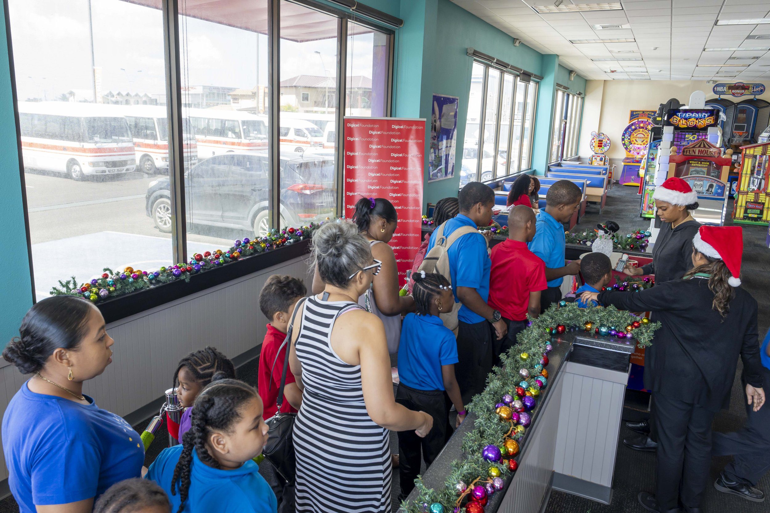  Let the fun begin! Students and teachers arrive early at Chuck E Cheese Chaguanas for the Digicel Foundation’s Children’s Christmas party, held on 28 November. 