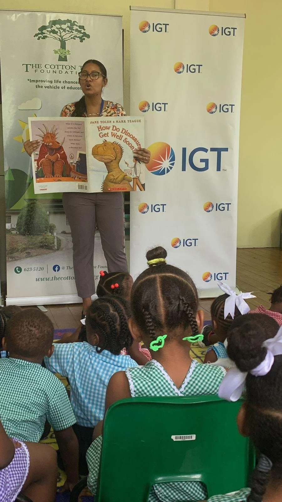 Pre-schoolers enjoy an animated storytelling session with IGT employee Kari Ann Dookie at the Cotton Tree Foundation in St. Anns on October 25 2023.