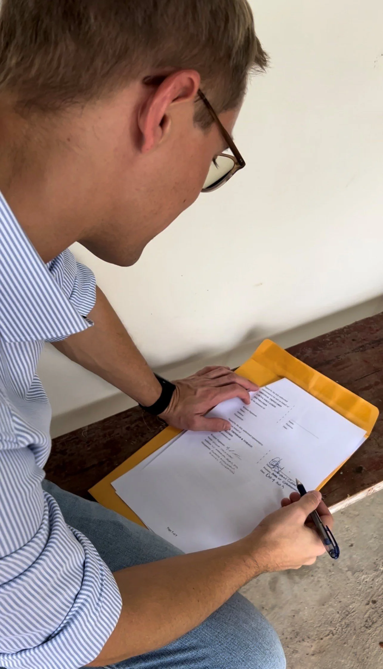  Tobias Schulze Frenking, Manager of the Original Trinitario Cocoa Education Foundation, signs the EPIC programme contract to initiate the group’s Climate-Smart Crop Storage project.  