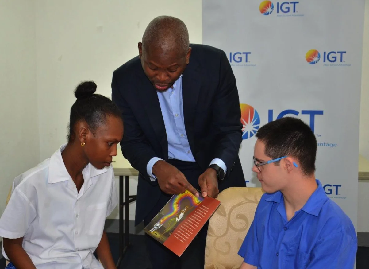 IGT General Manager Dexter W. Thomas engages students at the Immortelle Centre for Special Needs in a storytelling activity on May 24, 2023.