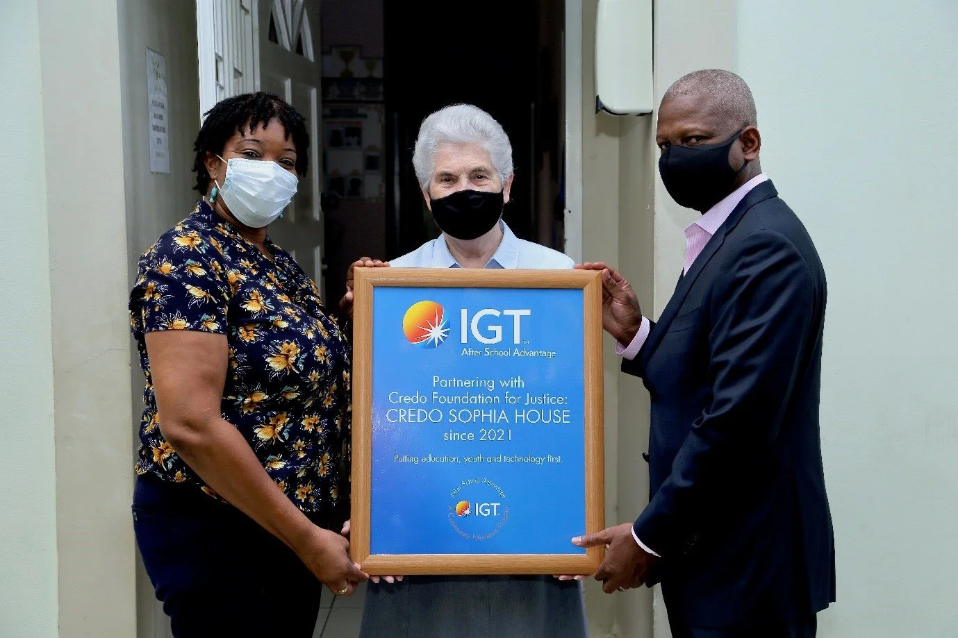 Photo 3: Making it Official! (From Left) IGT’s Deputy Country Manager- Dexter W. Thomas, Sr Roberta O'Flaherty of the Holy Faith Sisters & Chairperson of the Credo Foundation for Justice and Centre Coordinator, Ms Beverly John pose together for this permanent IGT After School Advantage (ASA) partnership.