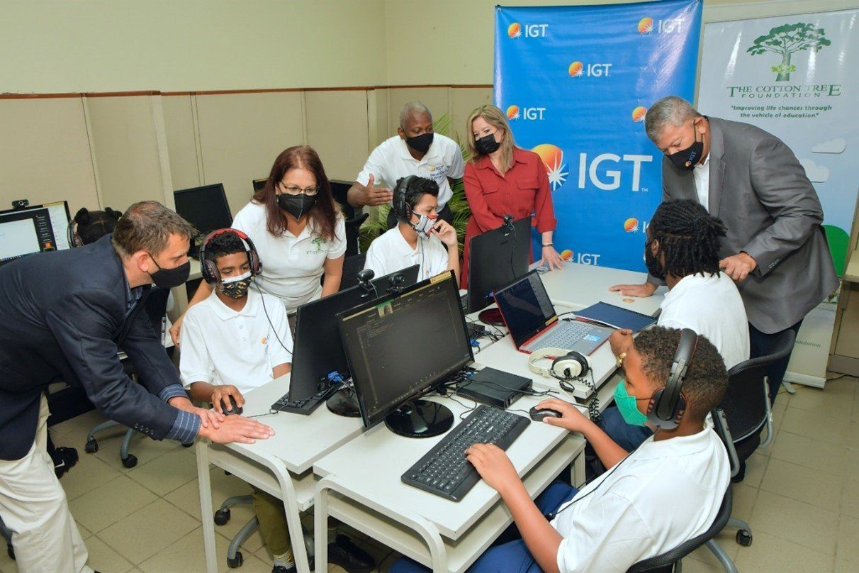 (L-R) Mr. Brendan Hames, IGT Caribbean Regional Director, Ms. Sita Persad - Executive Director at the CTF, IGT Deputy Country Manager Mr. Dexter W. Thomas, CTF director, Ms. Francesca Hawkins and IGT Country Manager Mr. Roger Bolai supervises the progress of the Cotton Tree Foundation students during a session of the second staging of IGT’s Coding and Robotics Rock! Camp 2022