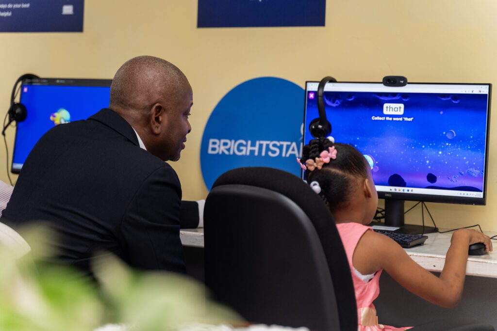 This youngster at The Living Water Community’s Our Lady of the Wayside Children’s Home shows off her reading skills to Dexter W. Thomas, General Manager, Brightstar Trinidad and Tobago, while using the educational programme ABCmouse.